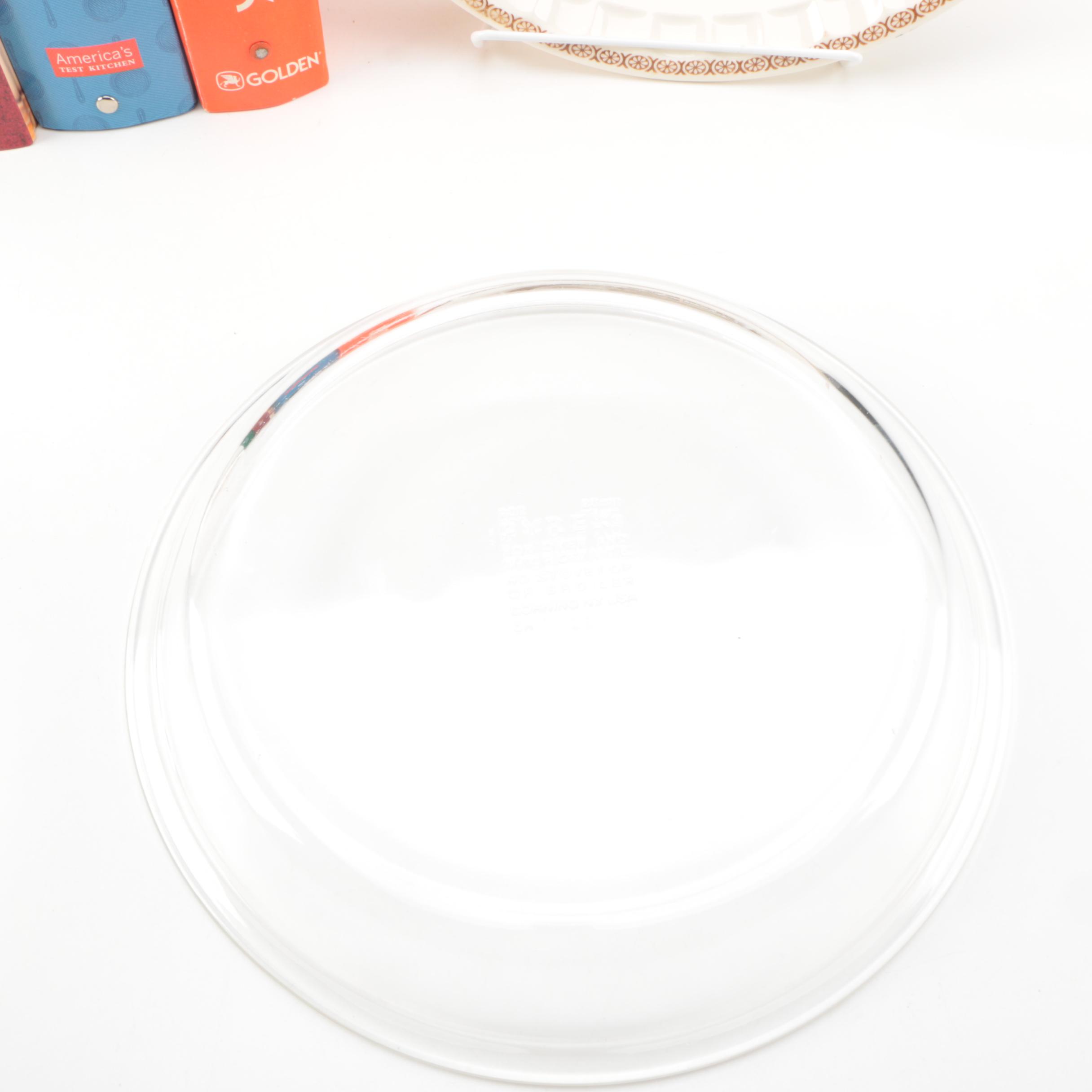 Assorted Cookbooks with Glass and Porcelain Dishes