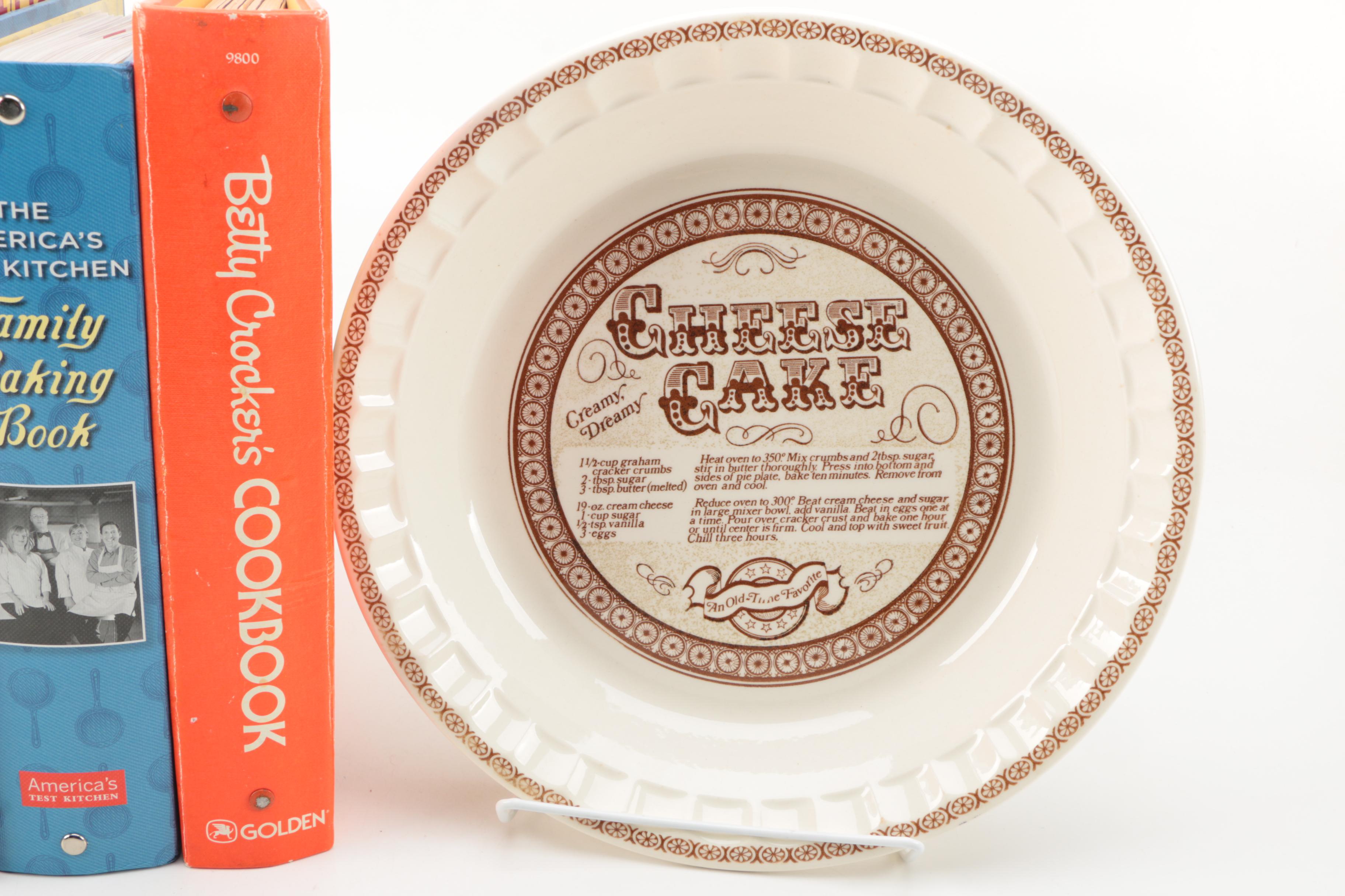 Assorted Cookbooks with Glass and Porcelain Dishes