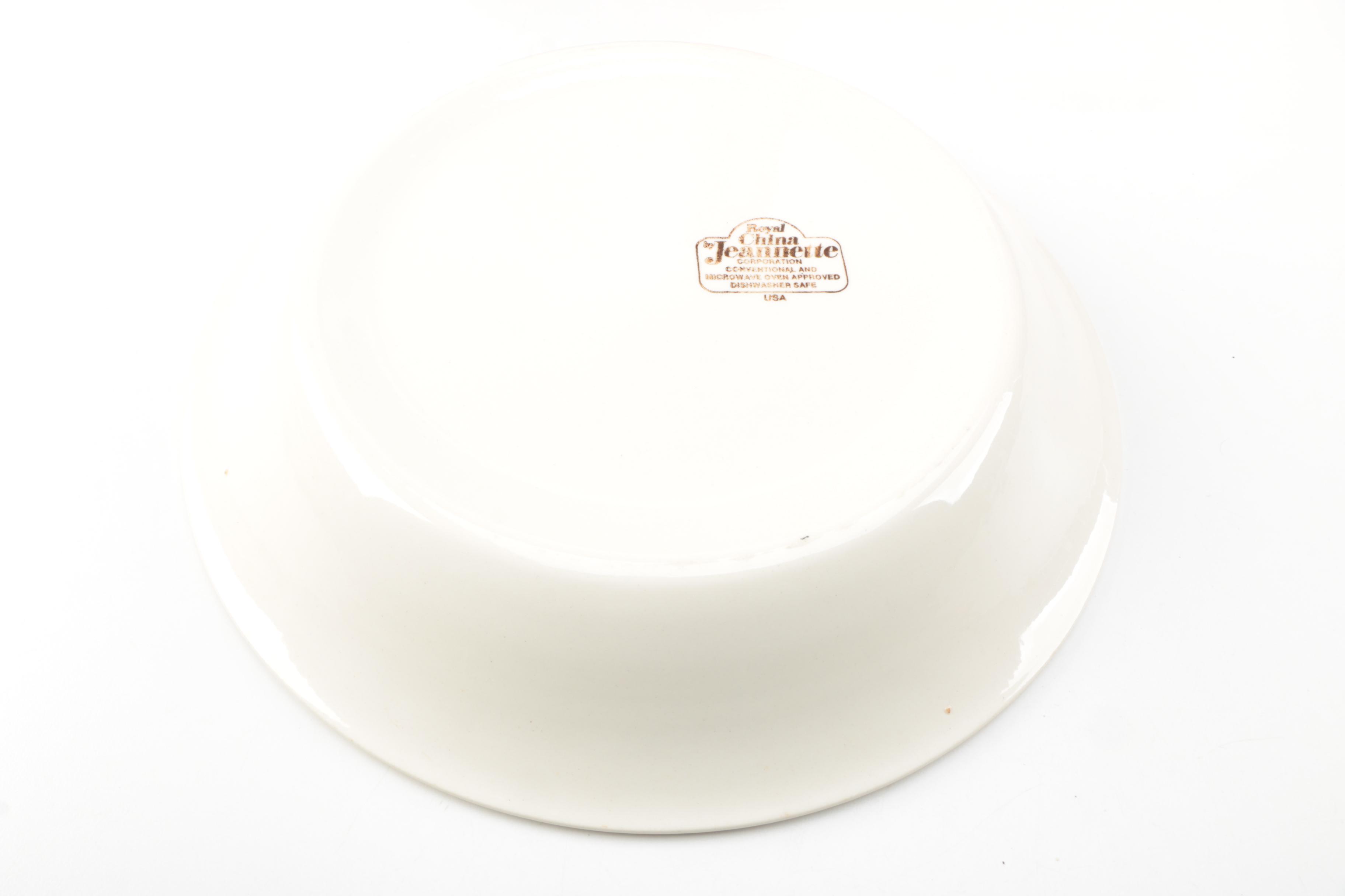 Assorted Cookbooks with Glass and Porcelain Dishes