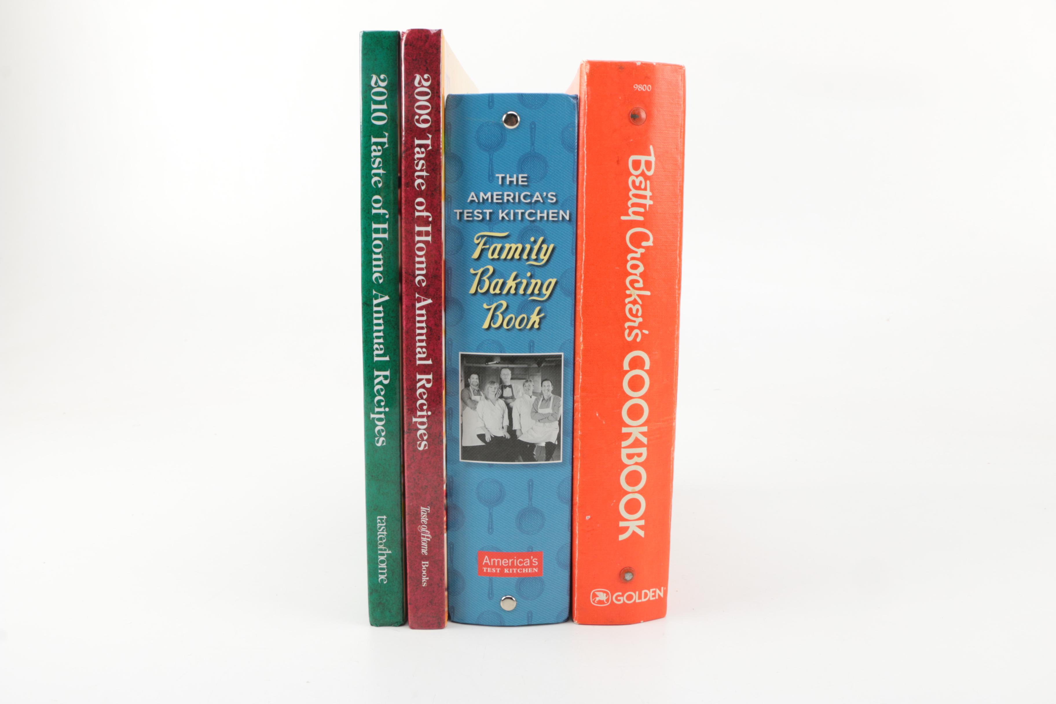 Assorted Cookbooks with Glass and Porcelain Dishes