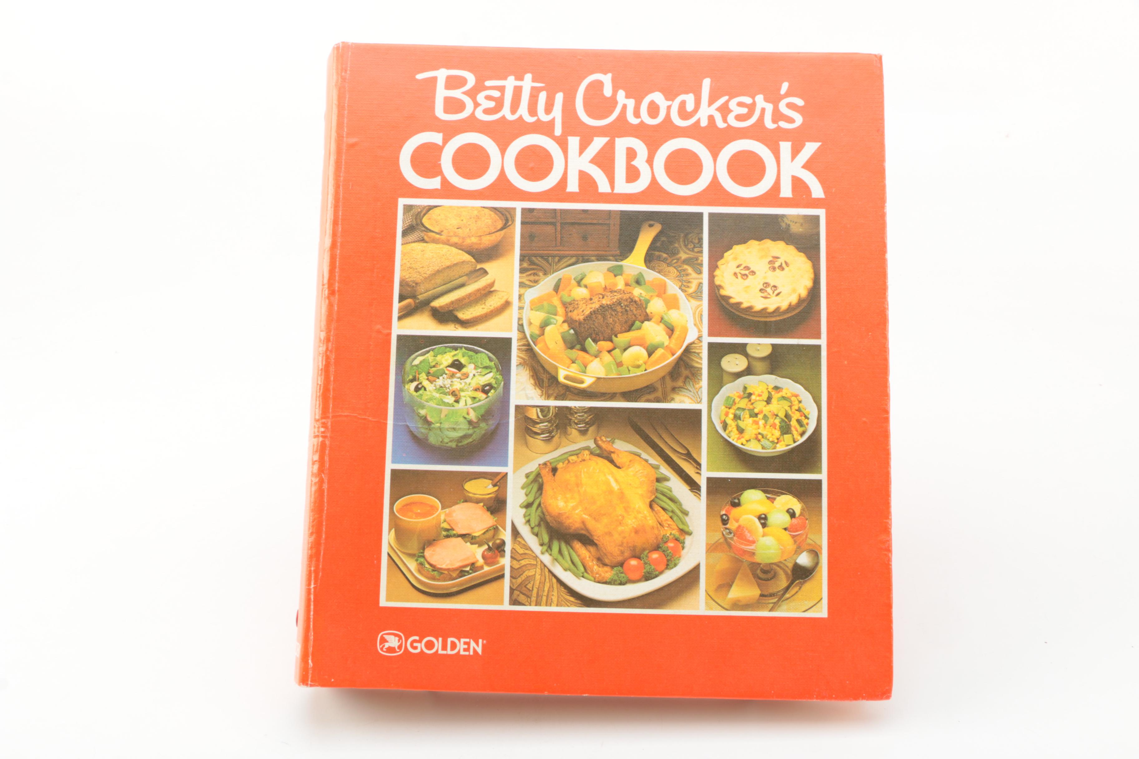 Assorted Cookbooks with Glass and Porcelain Dishes