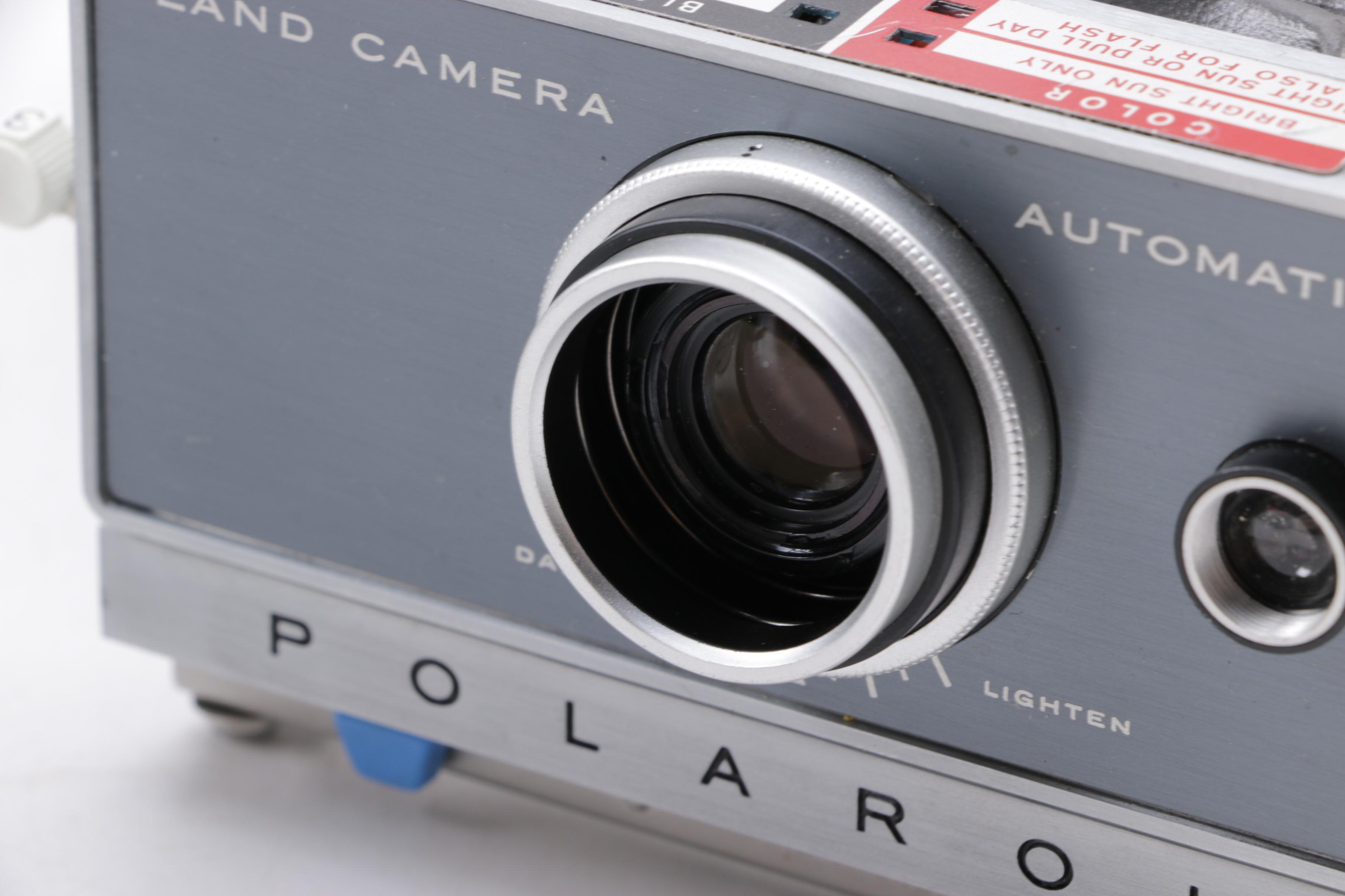 Polaroid Camera and Kodak Movie Light