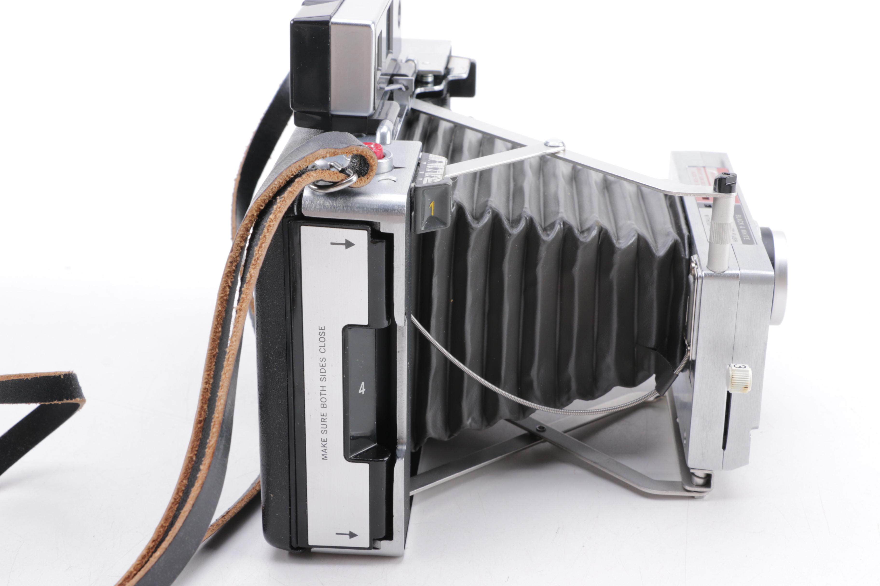 Polaroid Camera and Kodak Movie Light