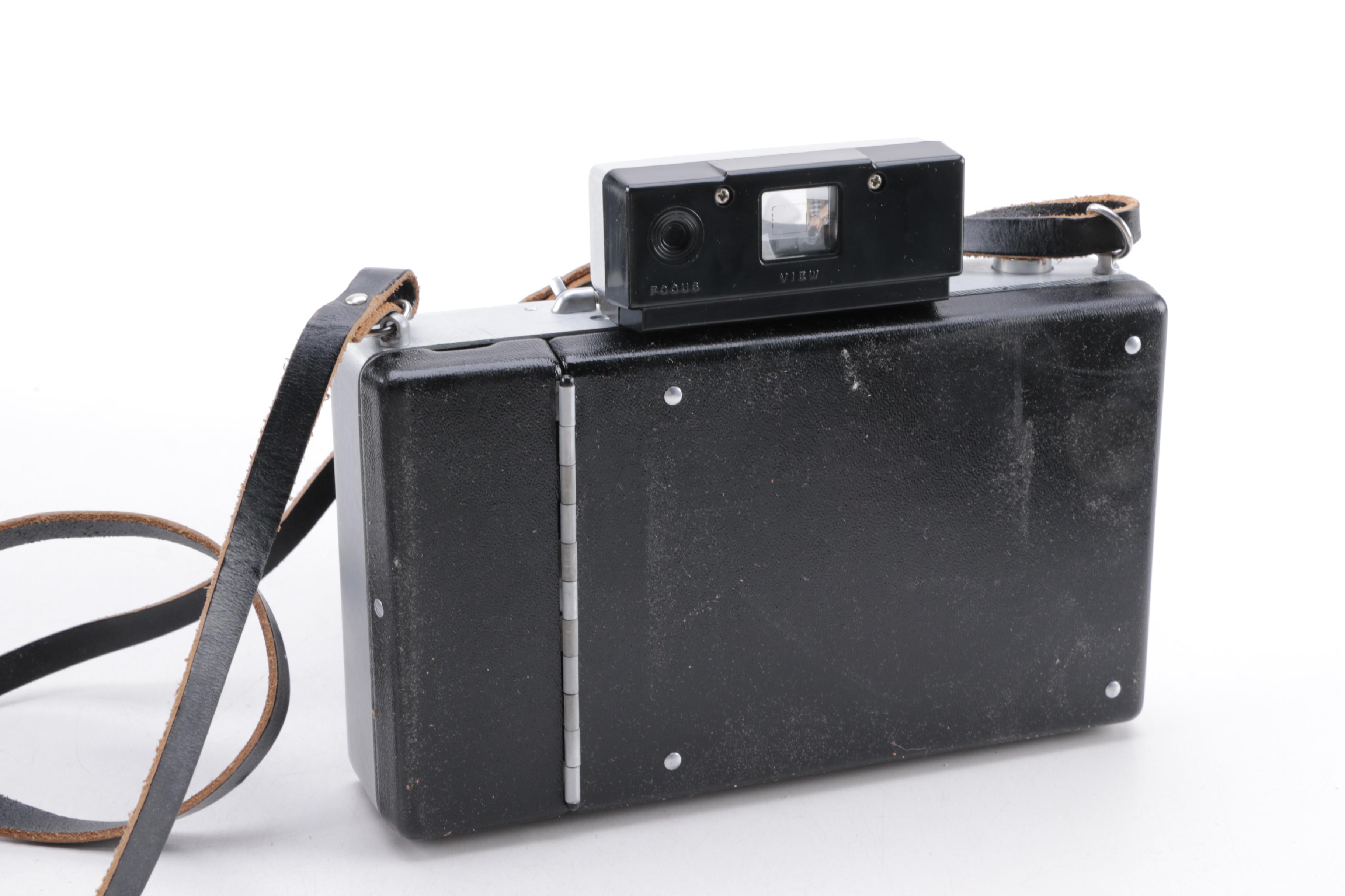 Polaroid Camera and Kodak Movie Light