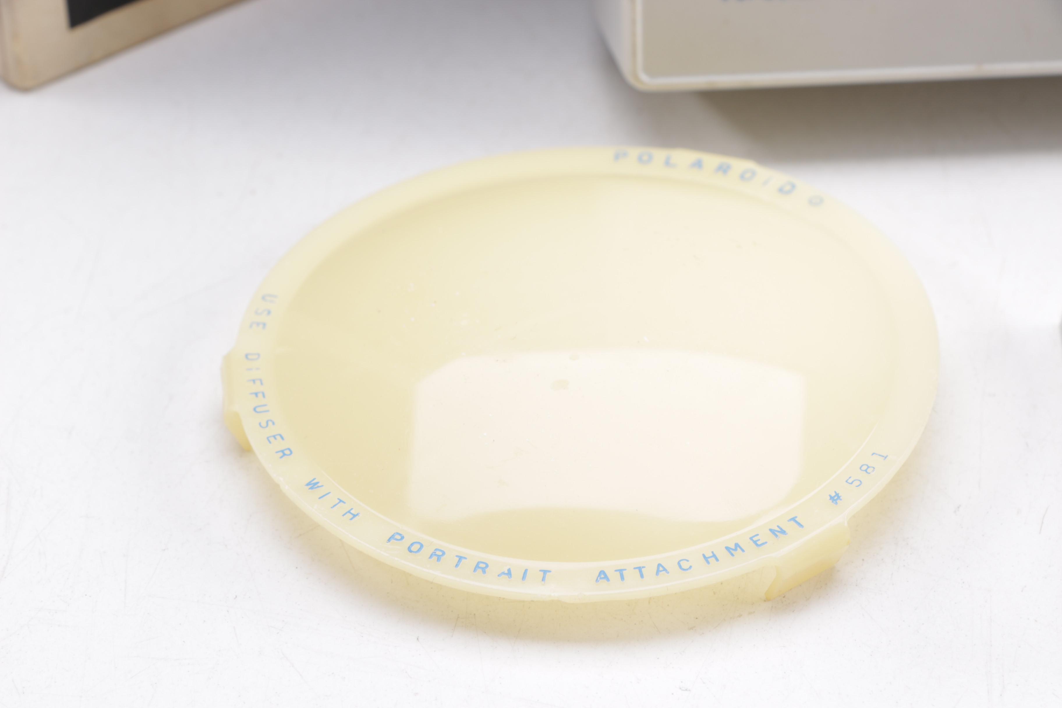 Polaroid Camera and Kodak Movie Light