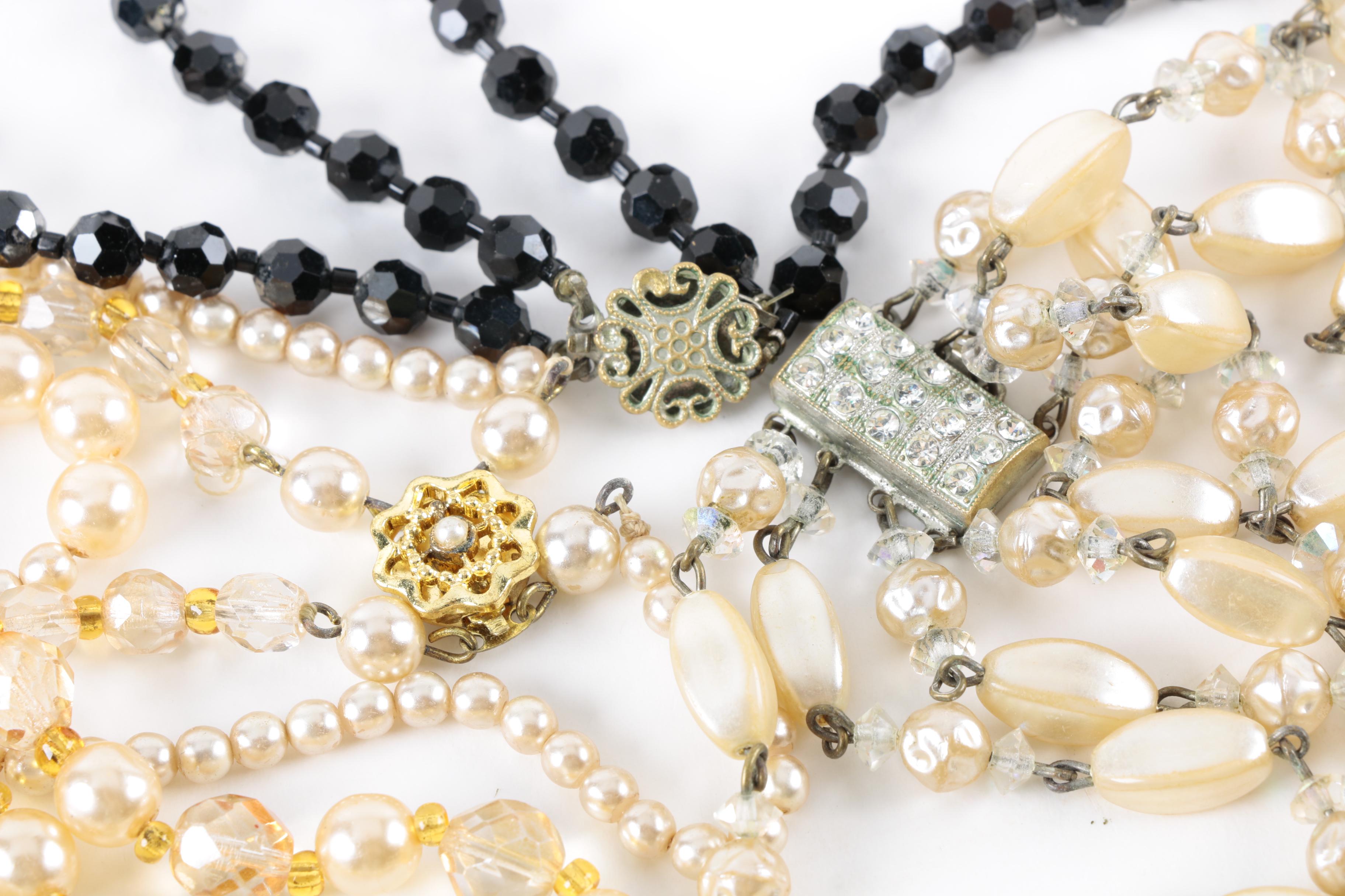 Vintage Costume Jewelry with Enamel, Mother of Pearl, and Glass Stones