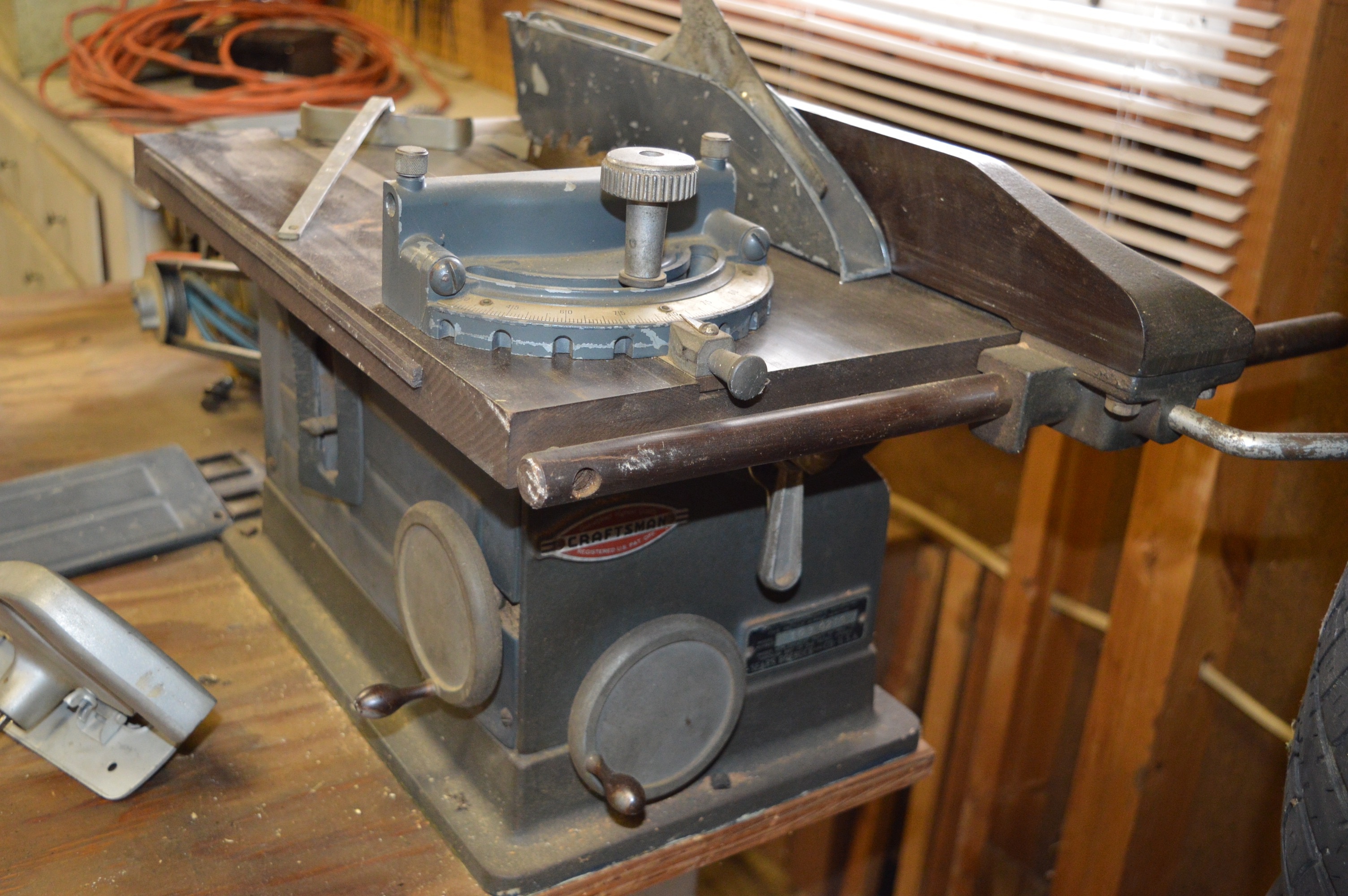 Work Station with Saw and Delta Bench Grinder and a Dual Height Workmate Table