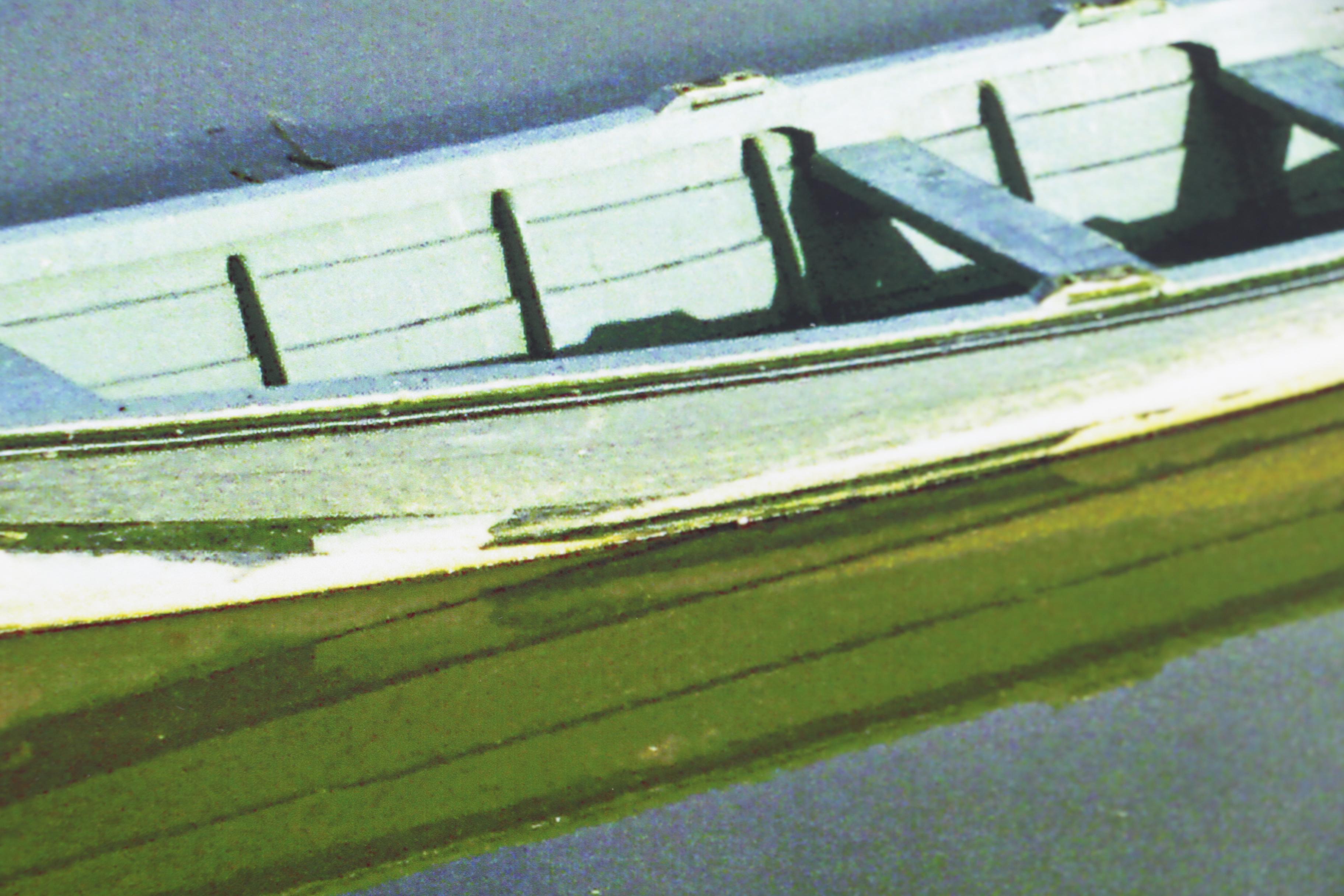 Color Photograph of Isolated Boat on Lake