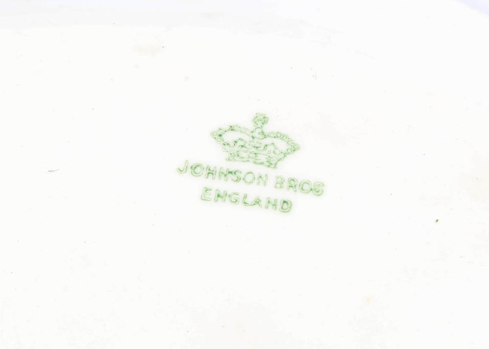 Large Assortment of Mismatched China Plates and Serving Pieces