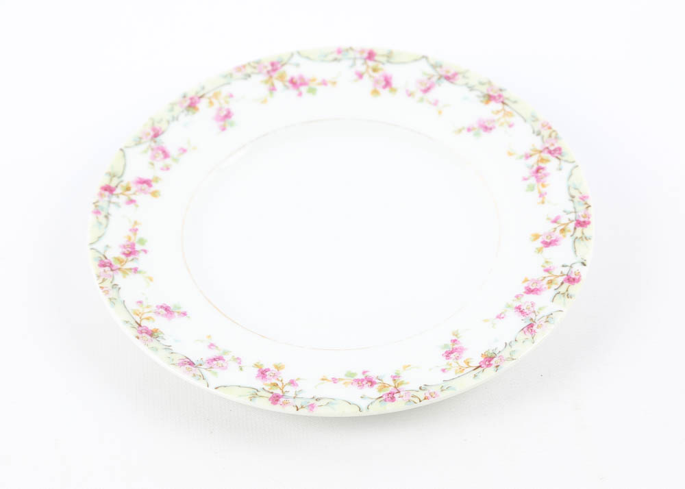 Large Assortment of Mismatched China Plates and Serving Pieces