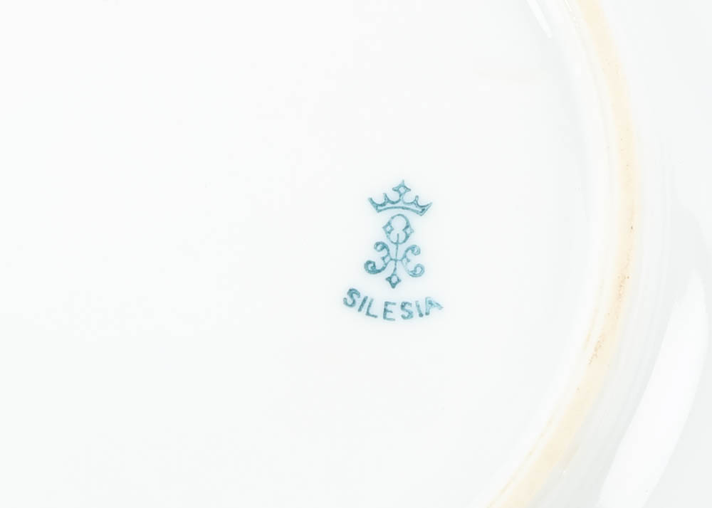 Large Assortment of Mismatched China Plates and Serving Pieces