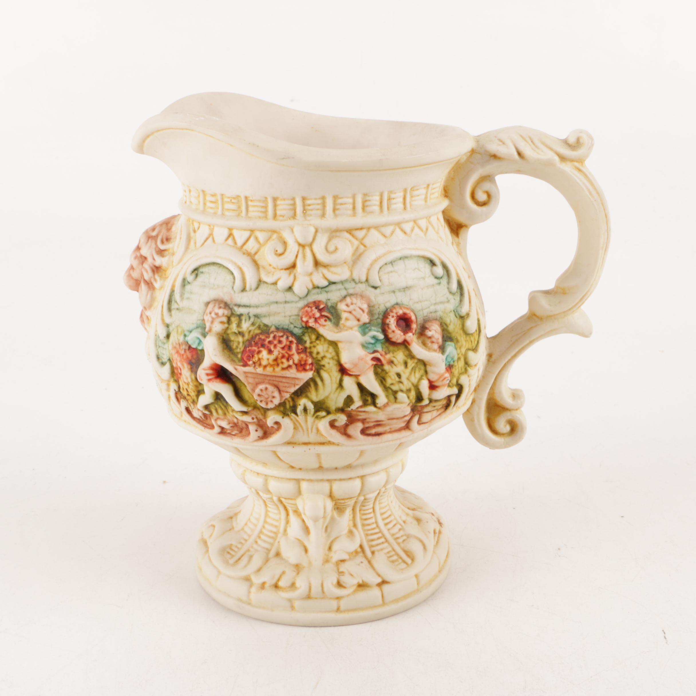 Capodimonte Style Cherub Pitcher and Ceramic Pitchers