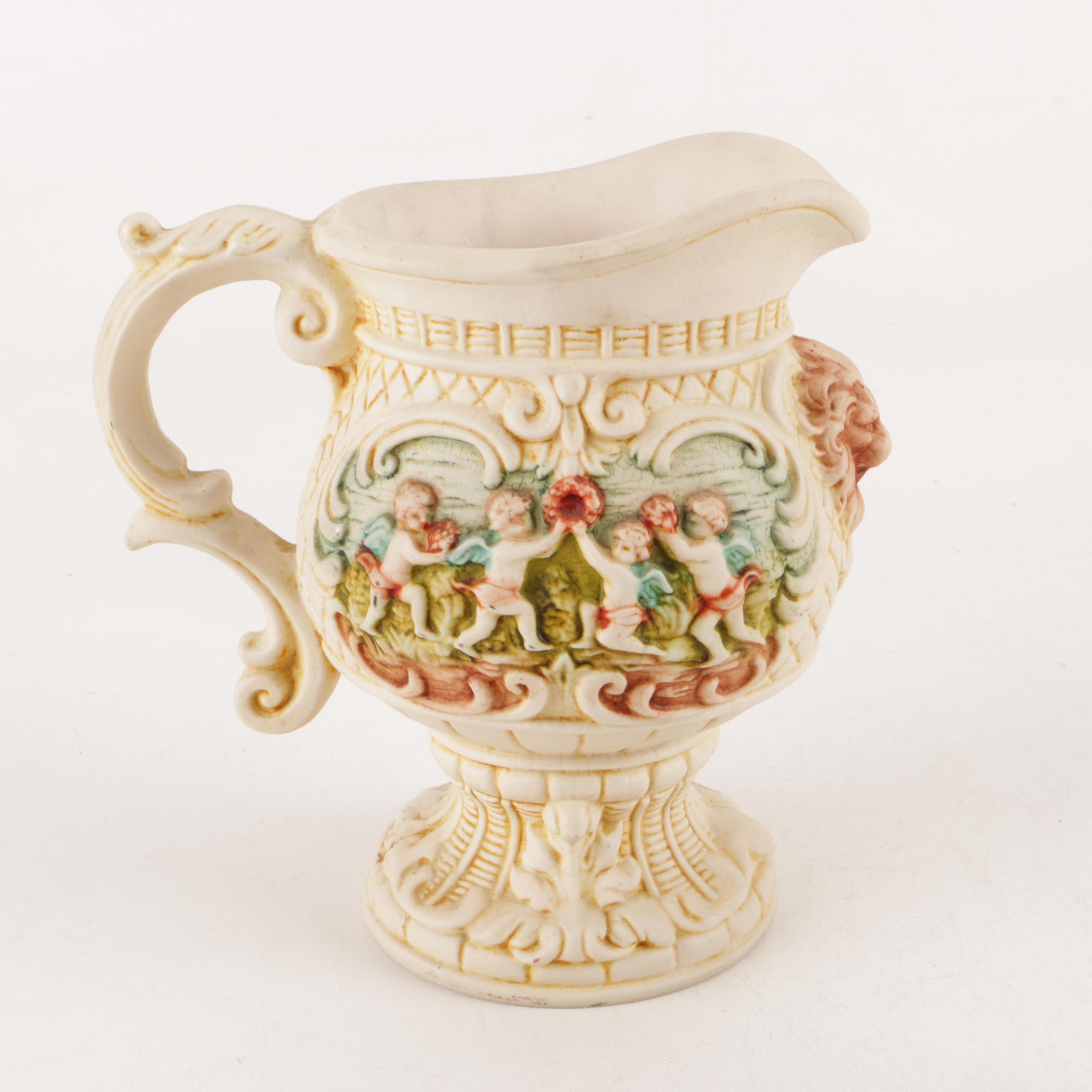 Capodimonte Style Cherub Pitcher and Ceramic Pitchers