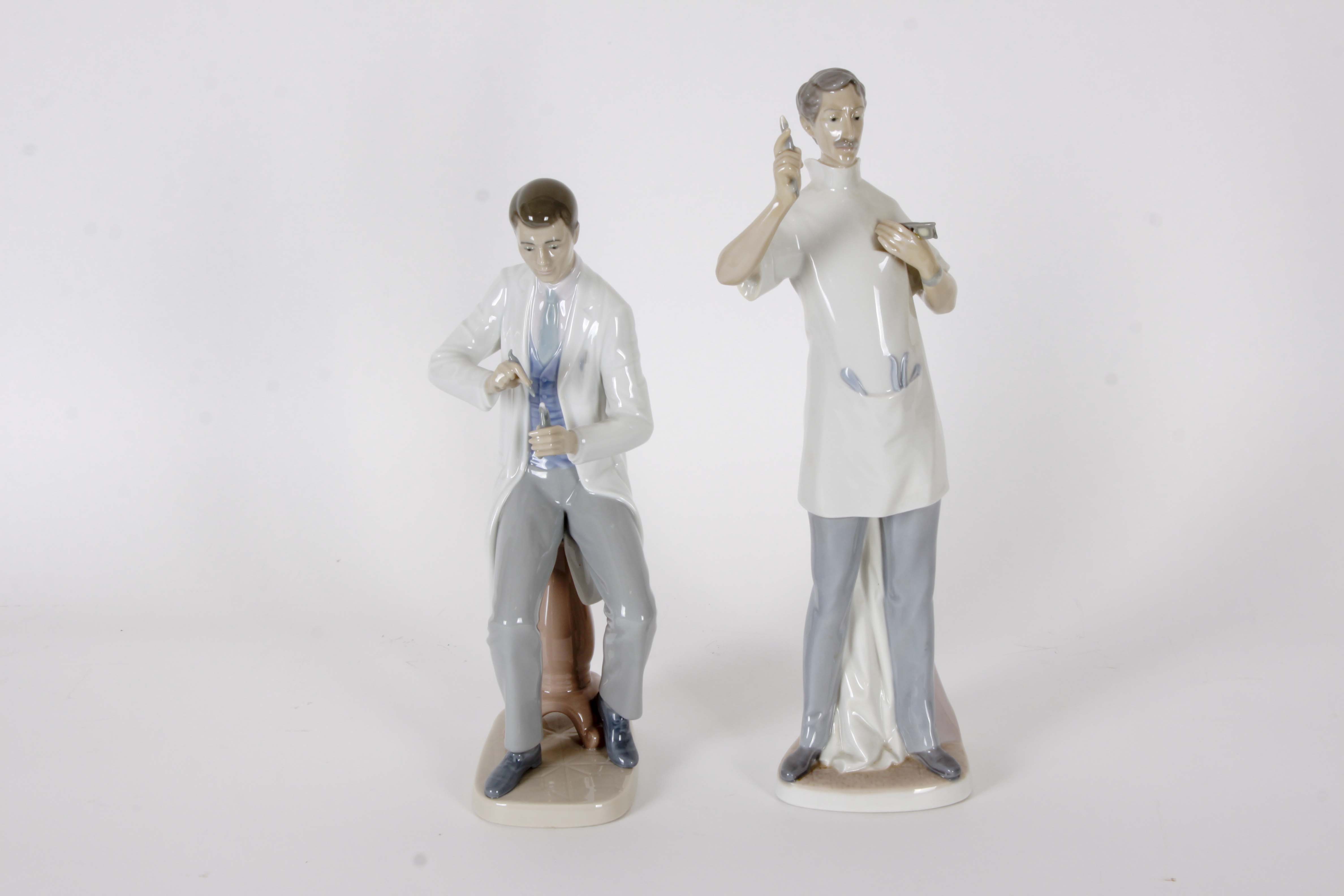 Pair of Lladro "Dentist" Figurines