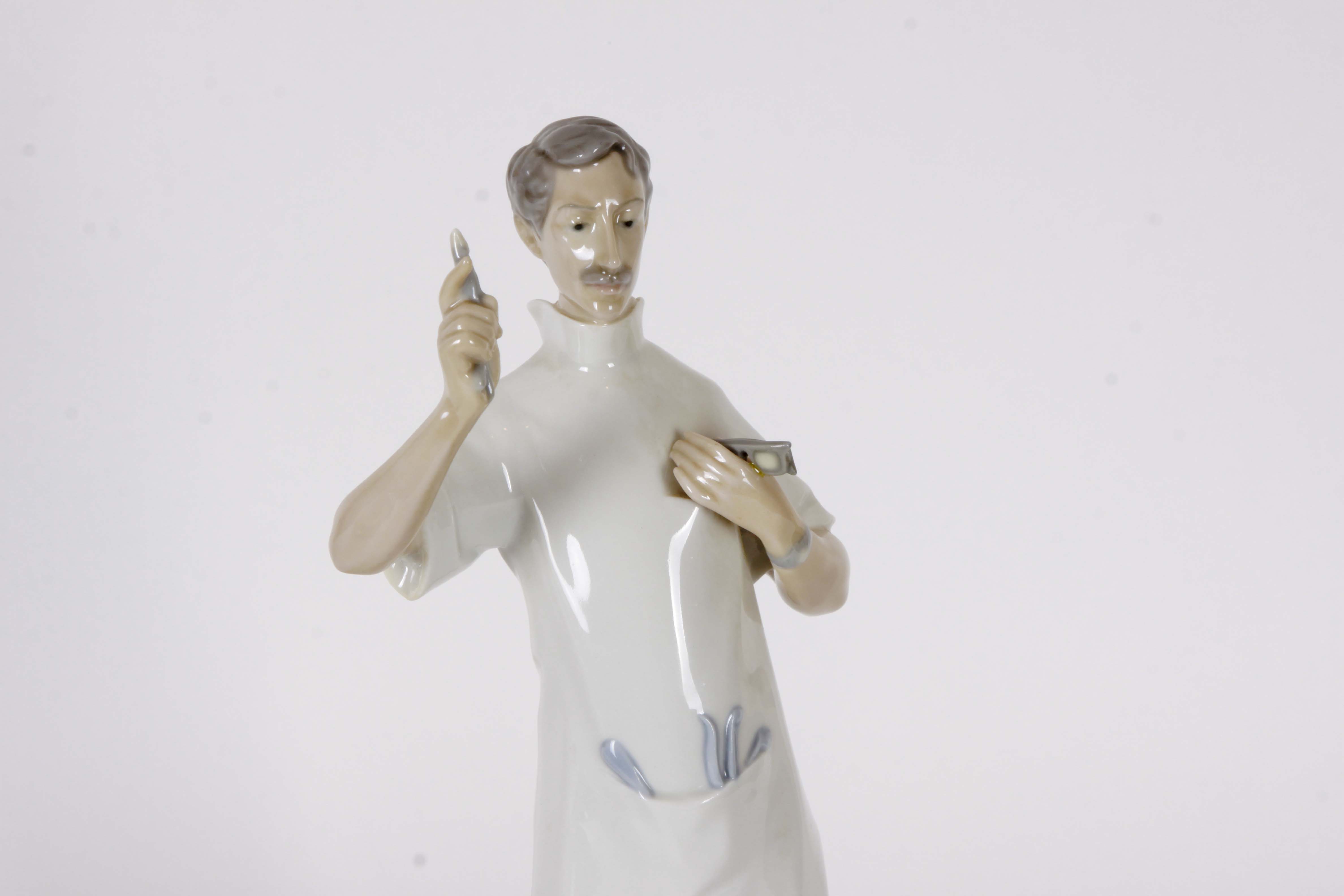 Pair of Lladro "Dentist" Figurines
