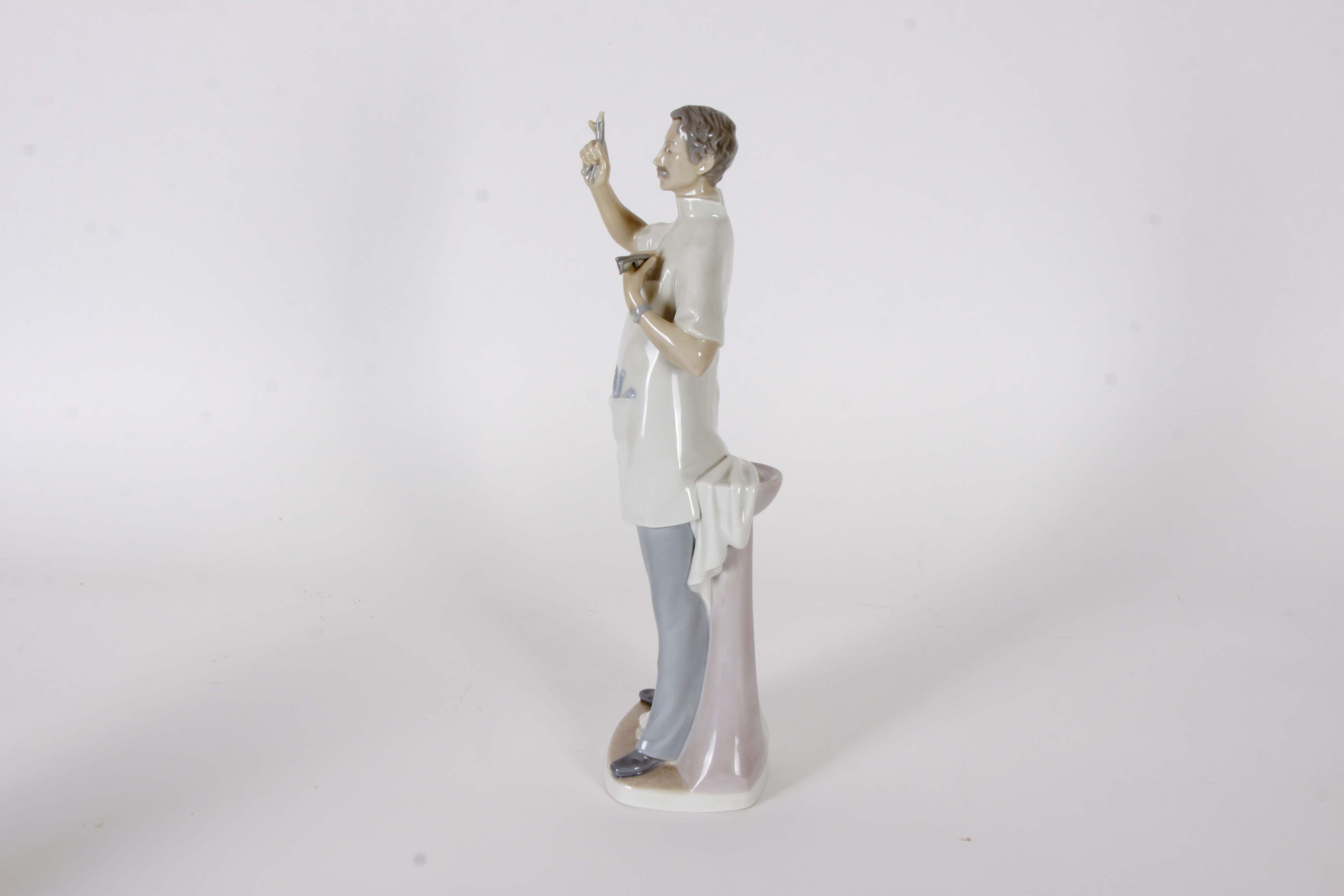 Pair of Lladro "Dentist" Figurines