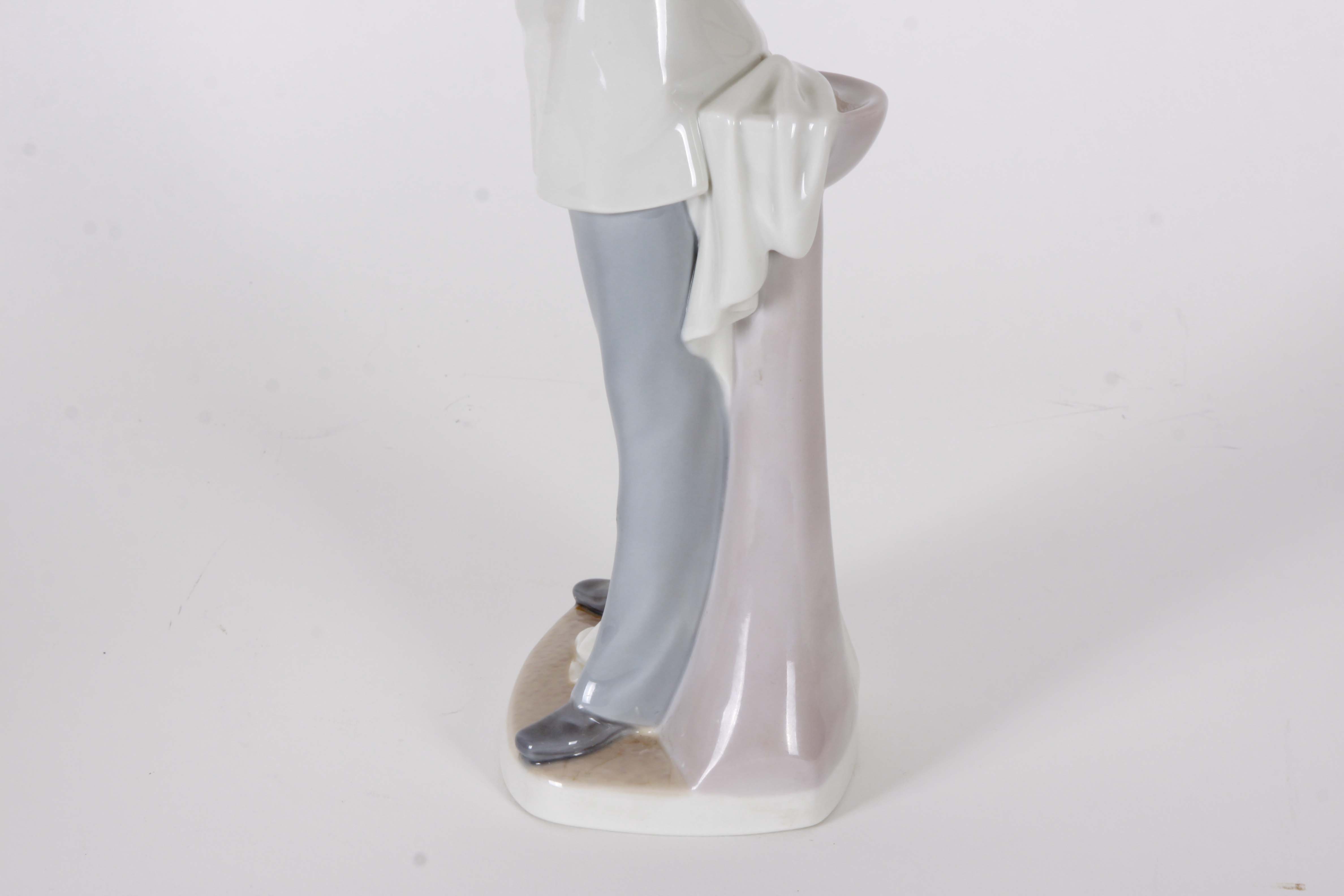 Pair of Lladro "Dentist" Figurines