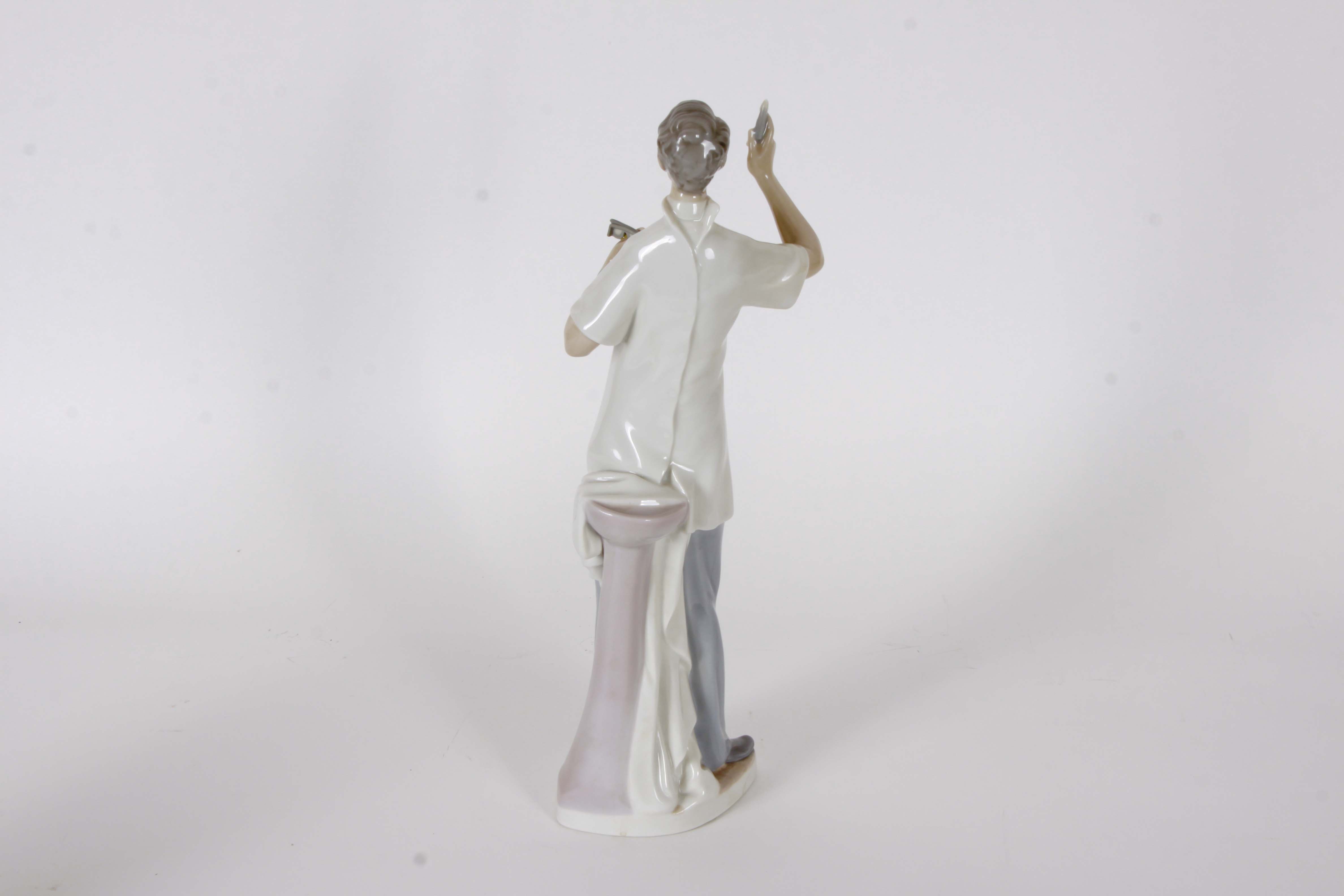 Pair of Lladro "Dentist" Figurines