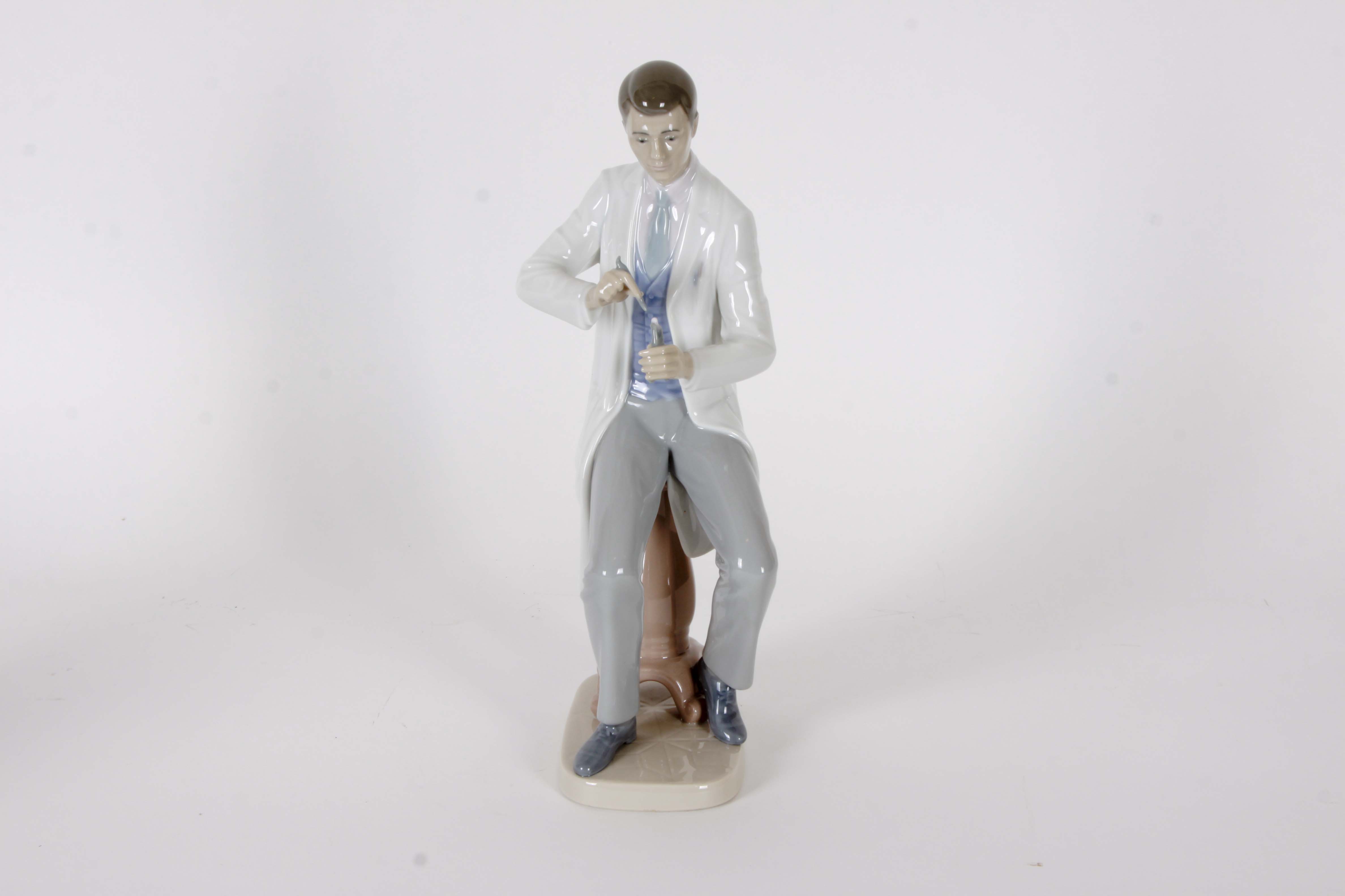 Pair of Lladro "Dentist" Figurines