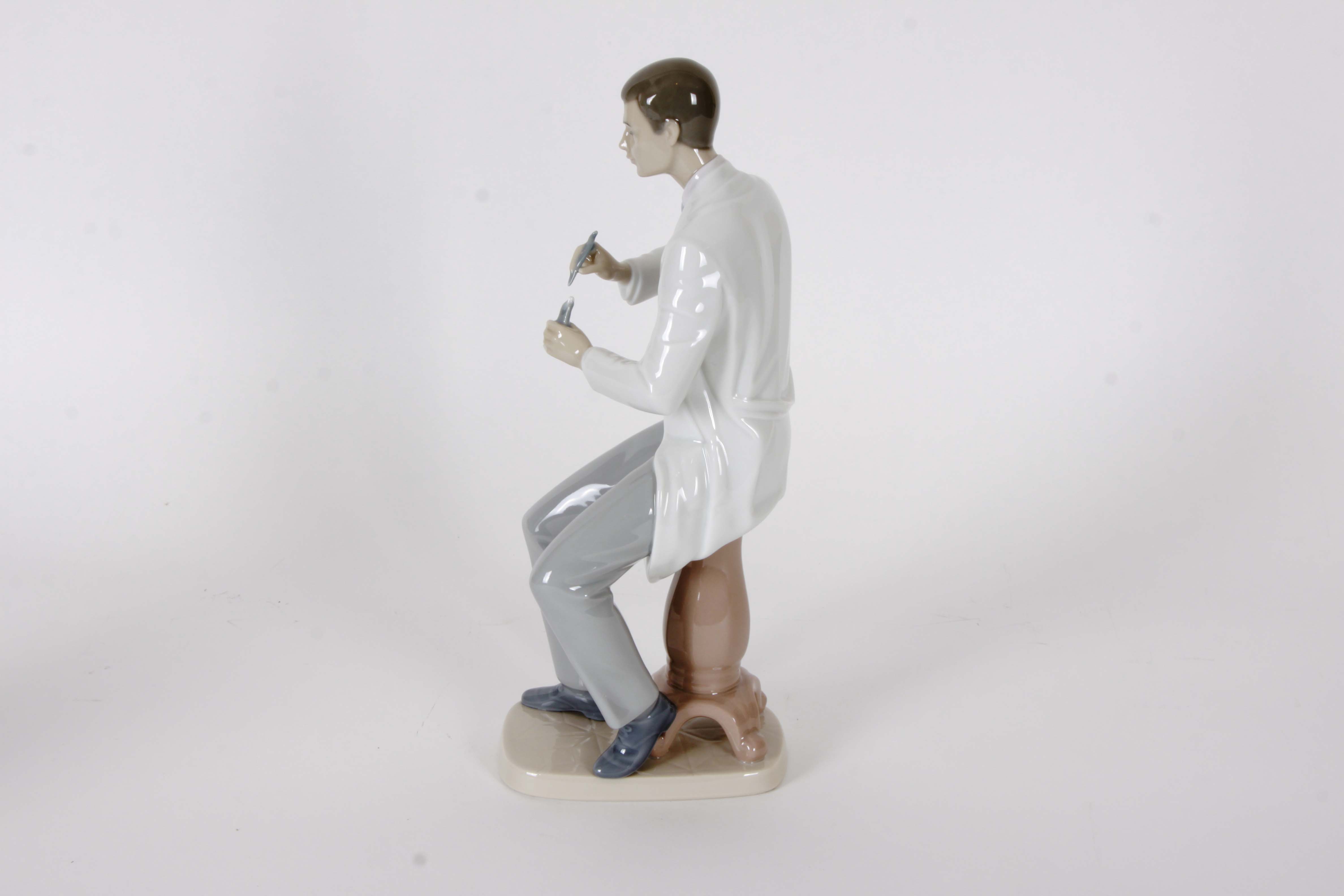 Pair of Lladro "Dentist" Figurines