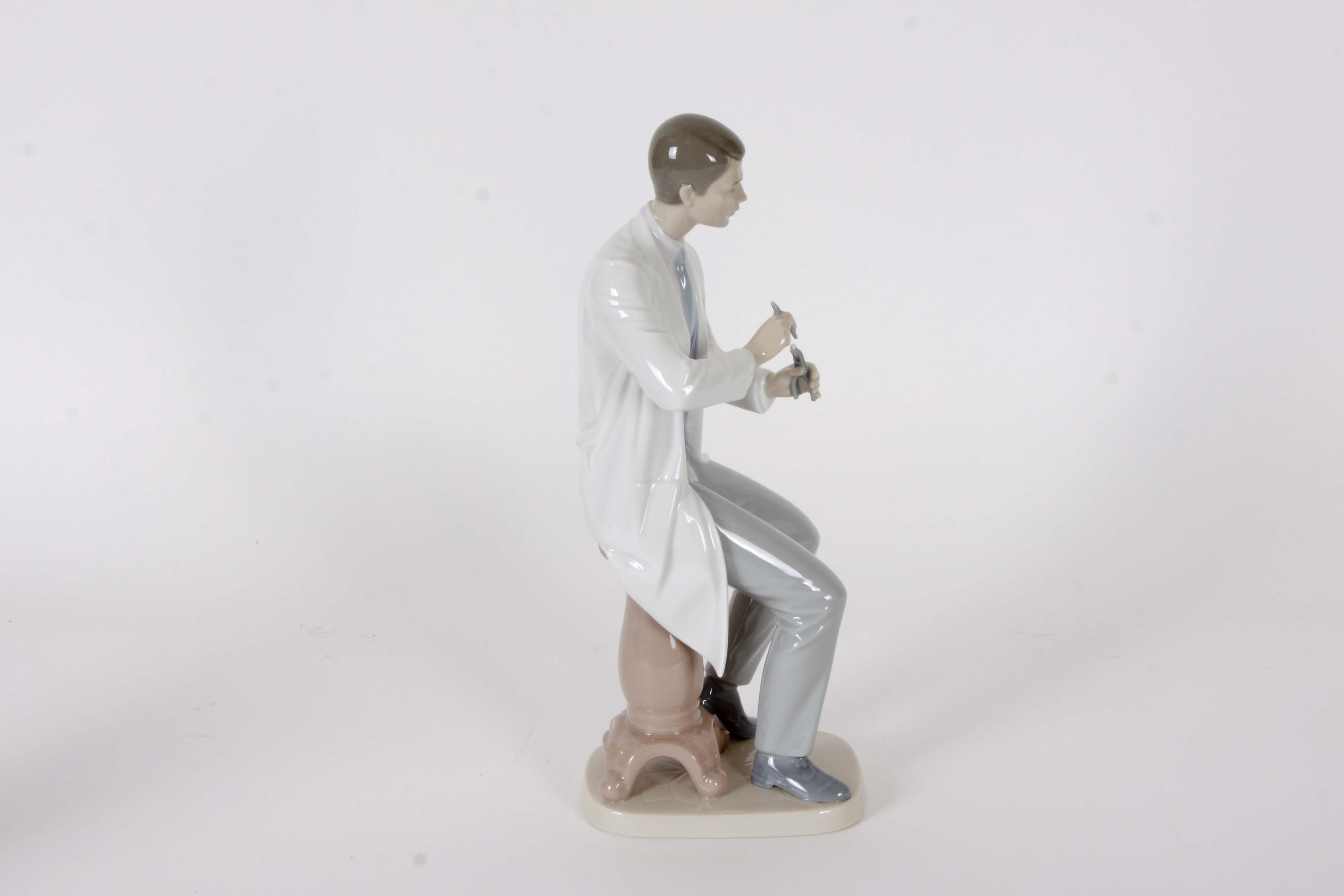 Pair of Lladro "Dentist" Figurines