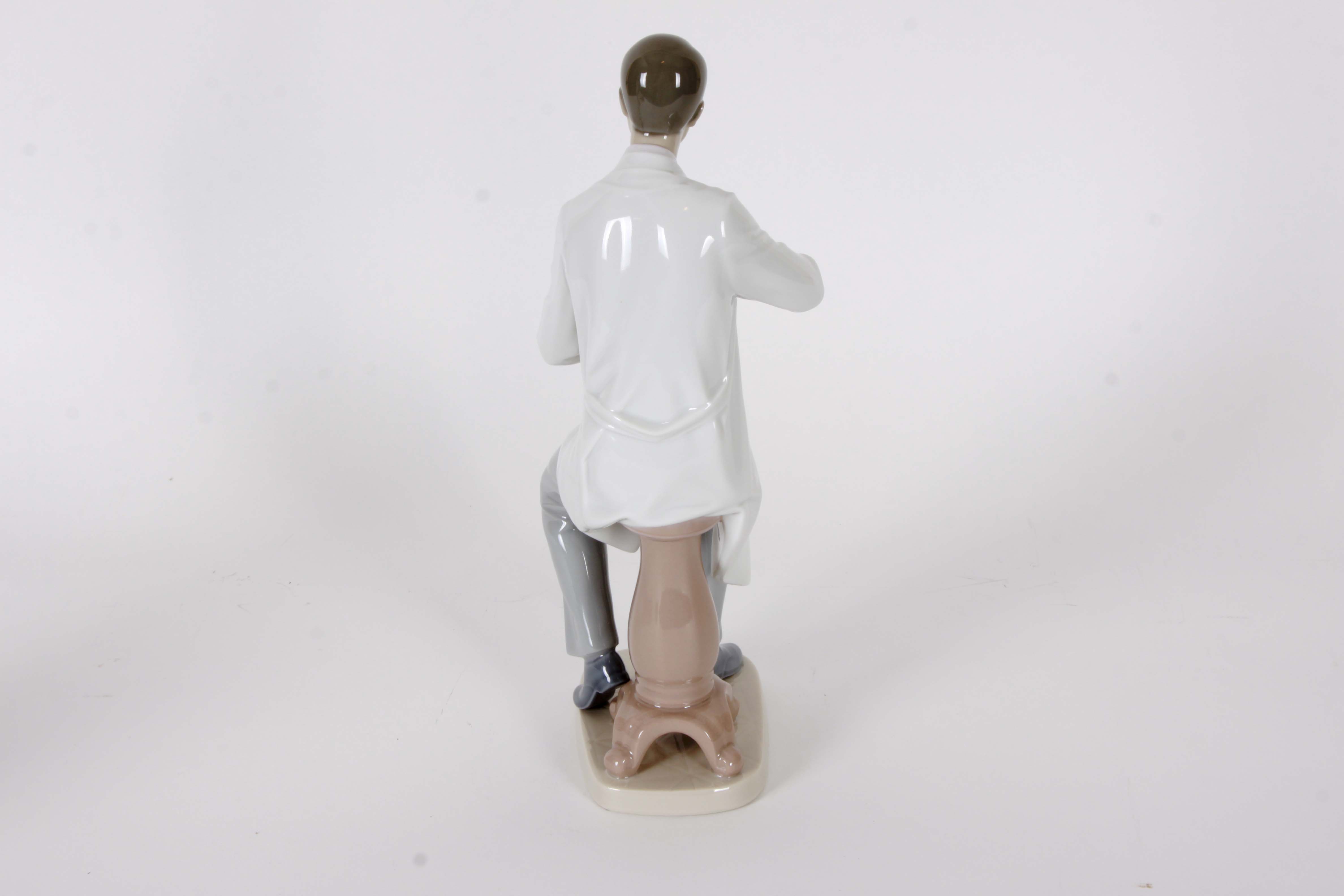 Pair of Lladro "Dentist" Figurines