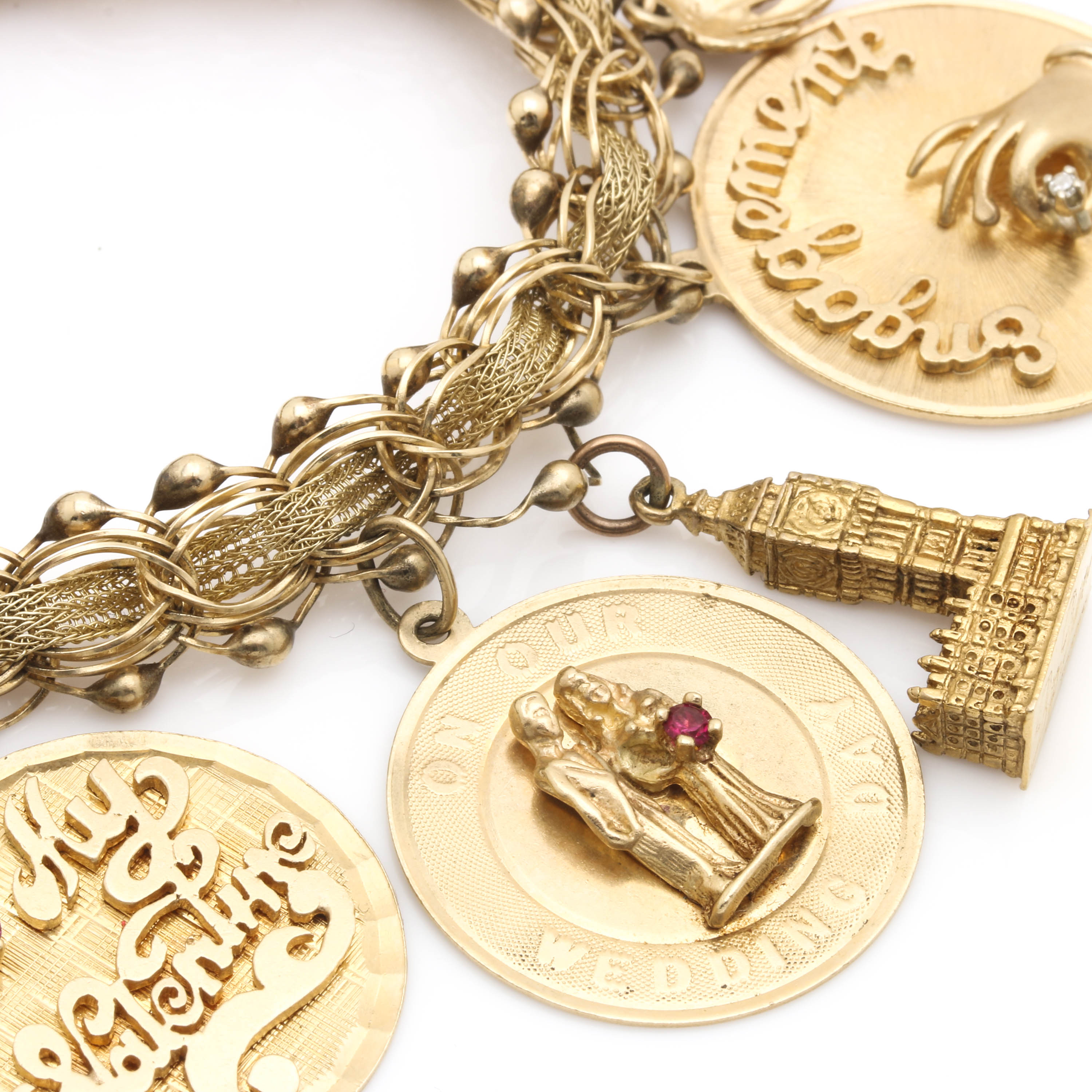 14K, 10K, and 18K Yellow Gold Charm Bracelet Including Gemstones