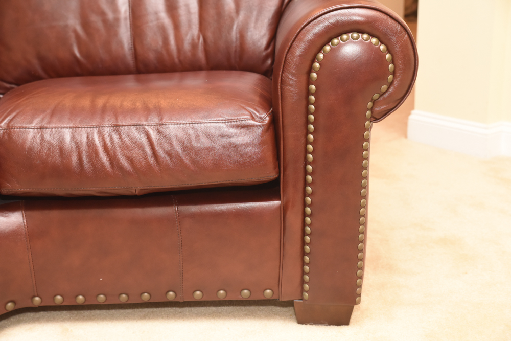 Brown Leather Curved Sectional Sofa with Ottoman by Star Furniture