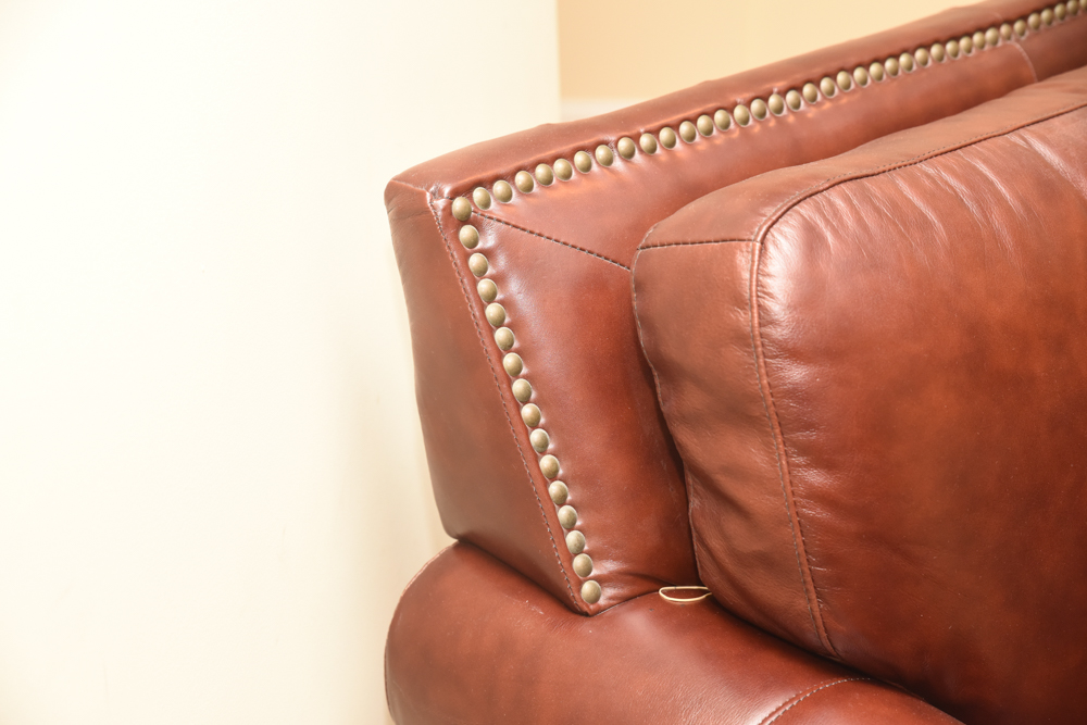 Brown Leather Curved Sectional Sofa with Ottoman by Star Furniture