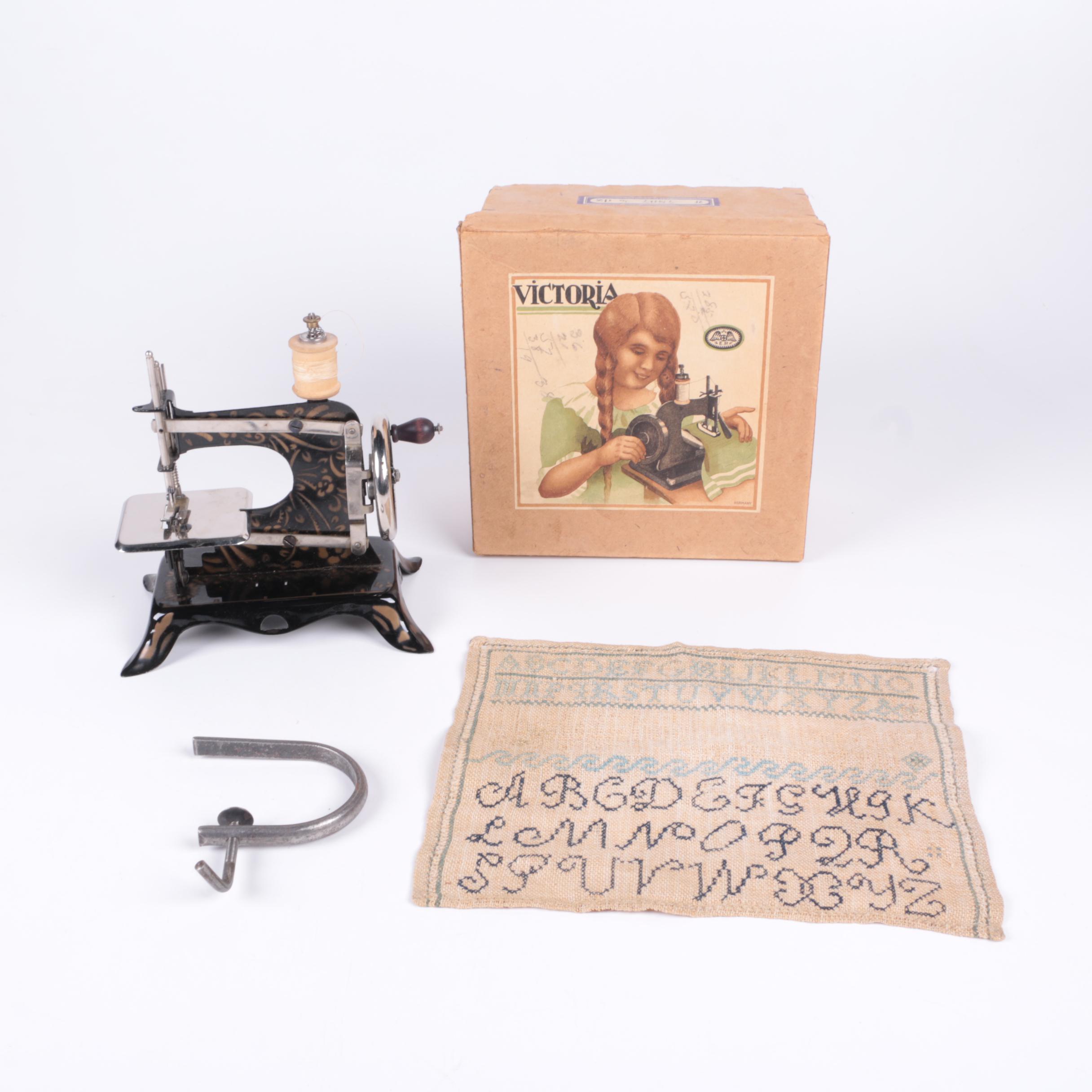 Ernst Plank Toy Sewing Machine with Box and Embroidered Sampler