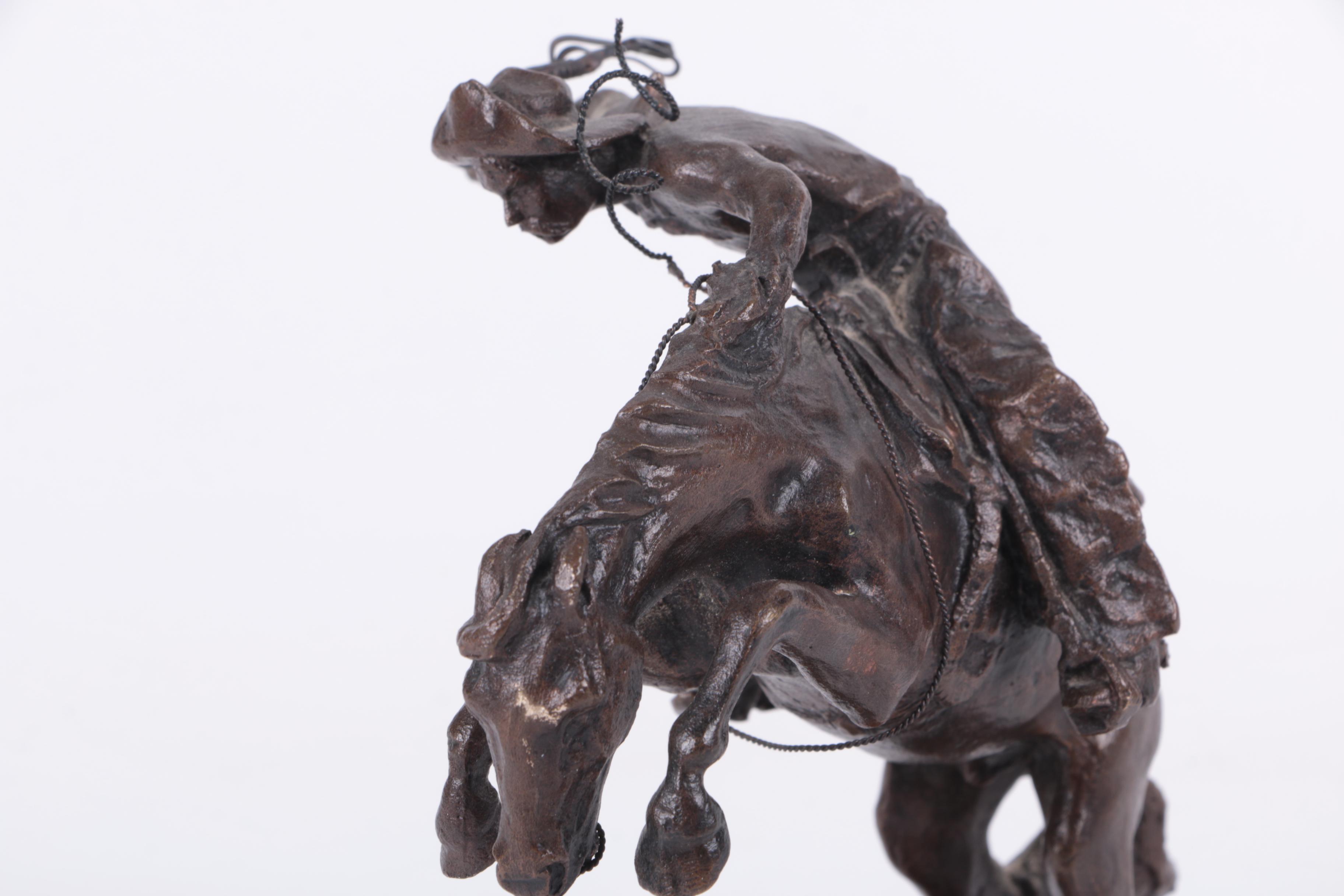 "The Bronco Buster" Horse Figurine