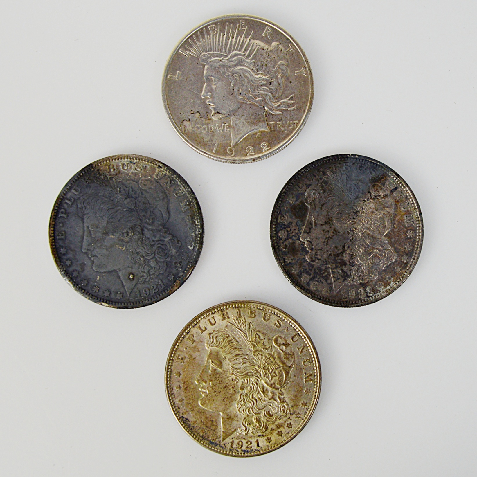 1922 Silver Peace Dollar and Three 1921 Morgan Silver Dollars