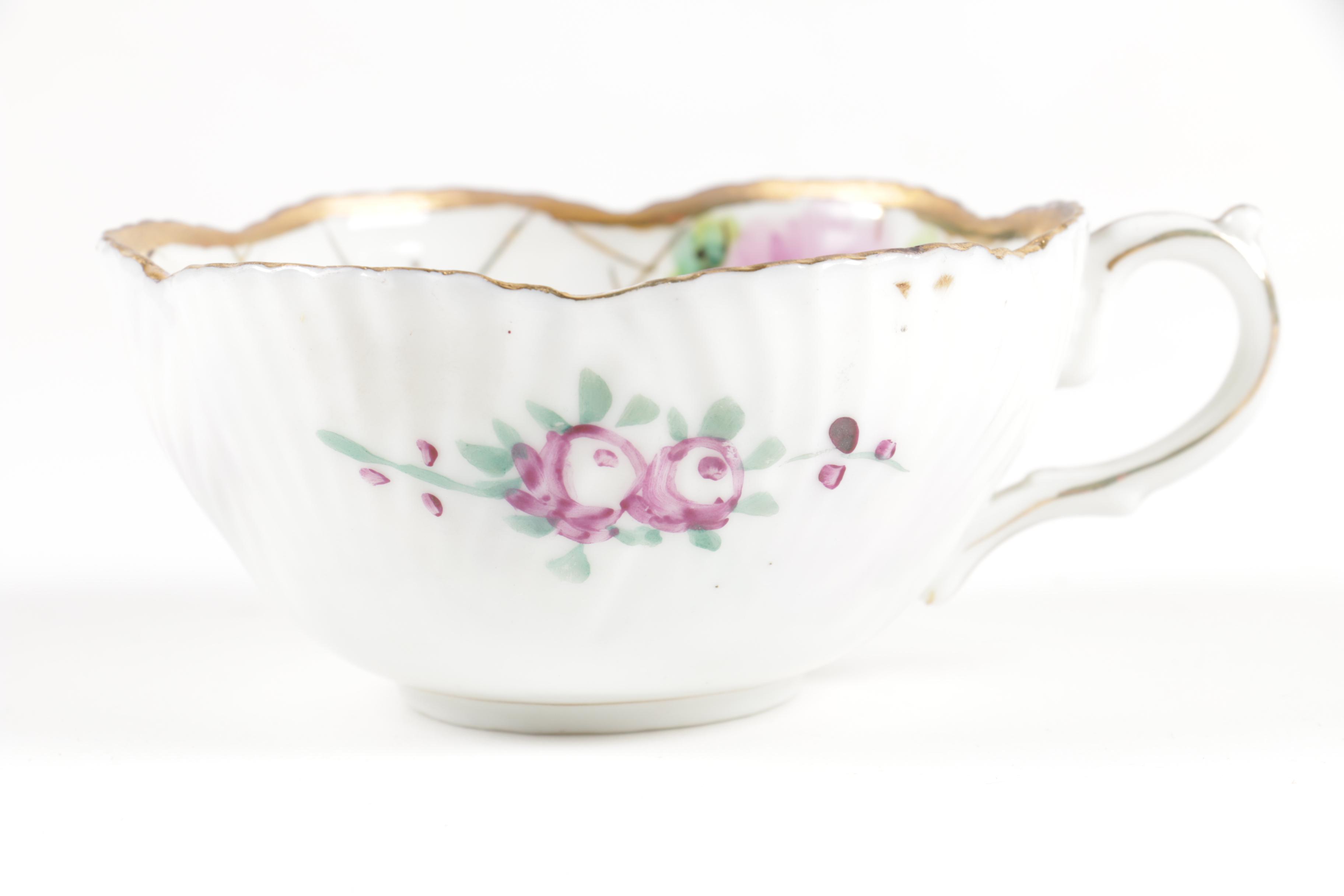Hand Painted Teacup with Two Saucers