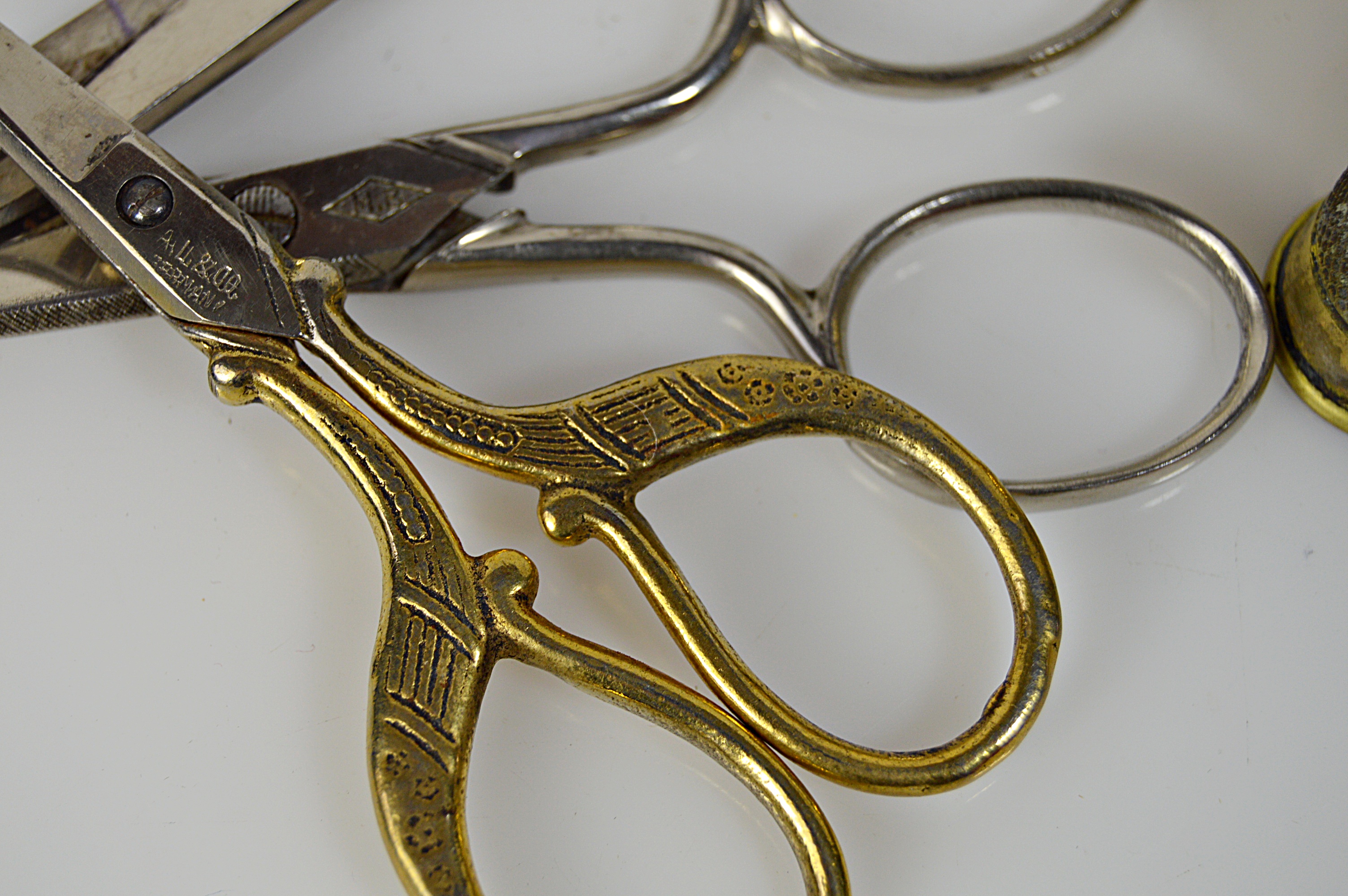 Vintage Sewing Collectibles with Glass Darning Egg, Sterling Thimbles, Scissors