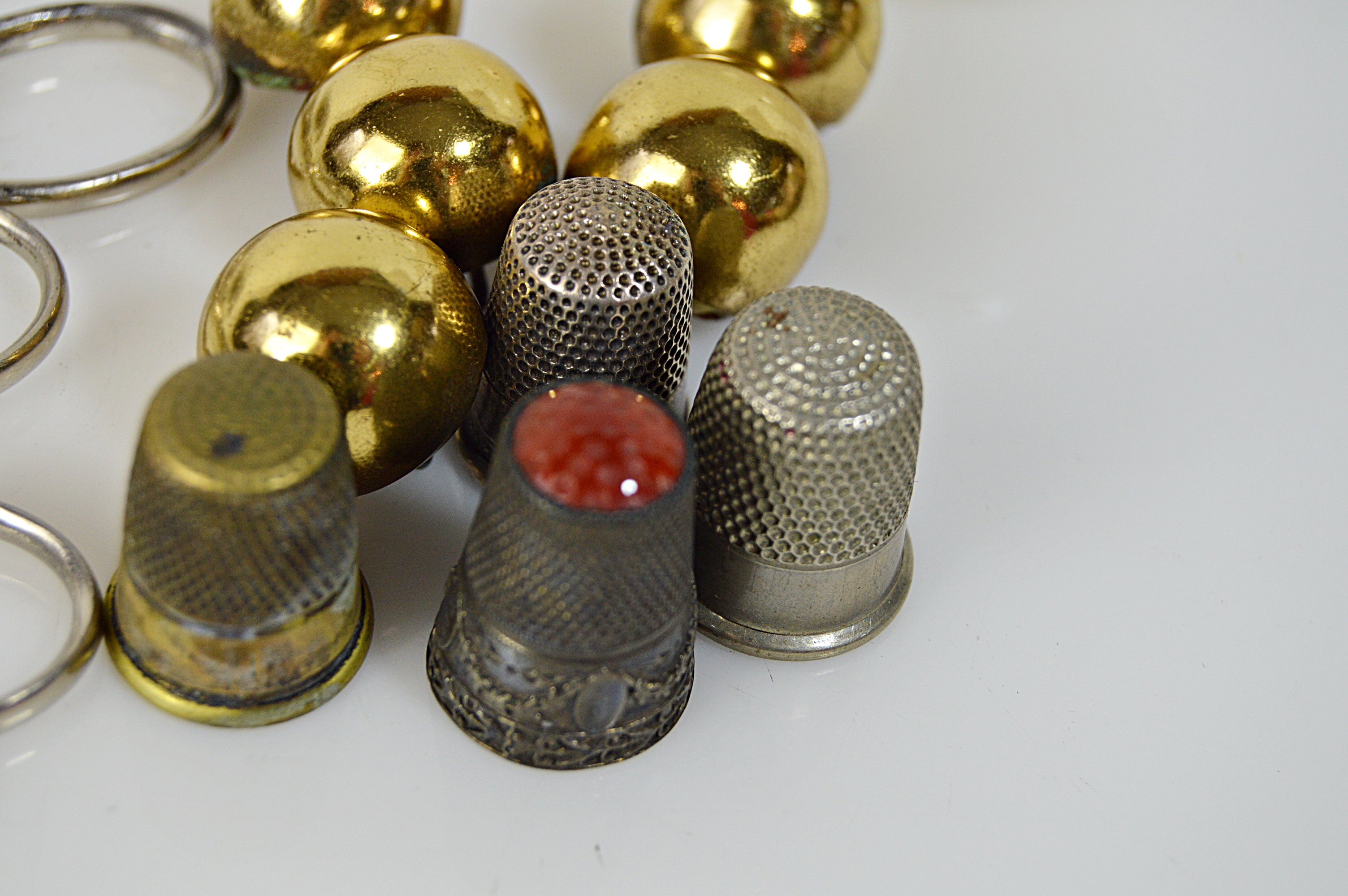 Vintage Sewing Collectibles with Glass Darning Egg, Sterling Thimbles, Scissors