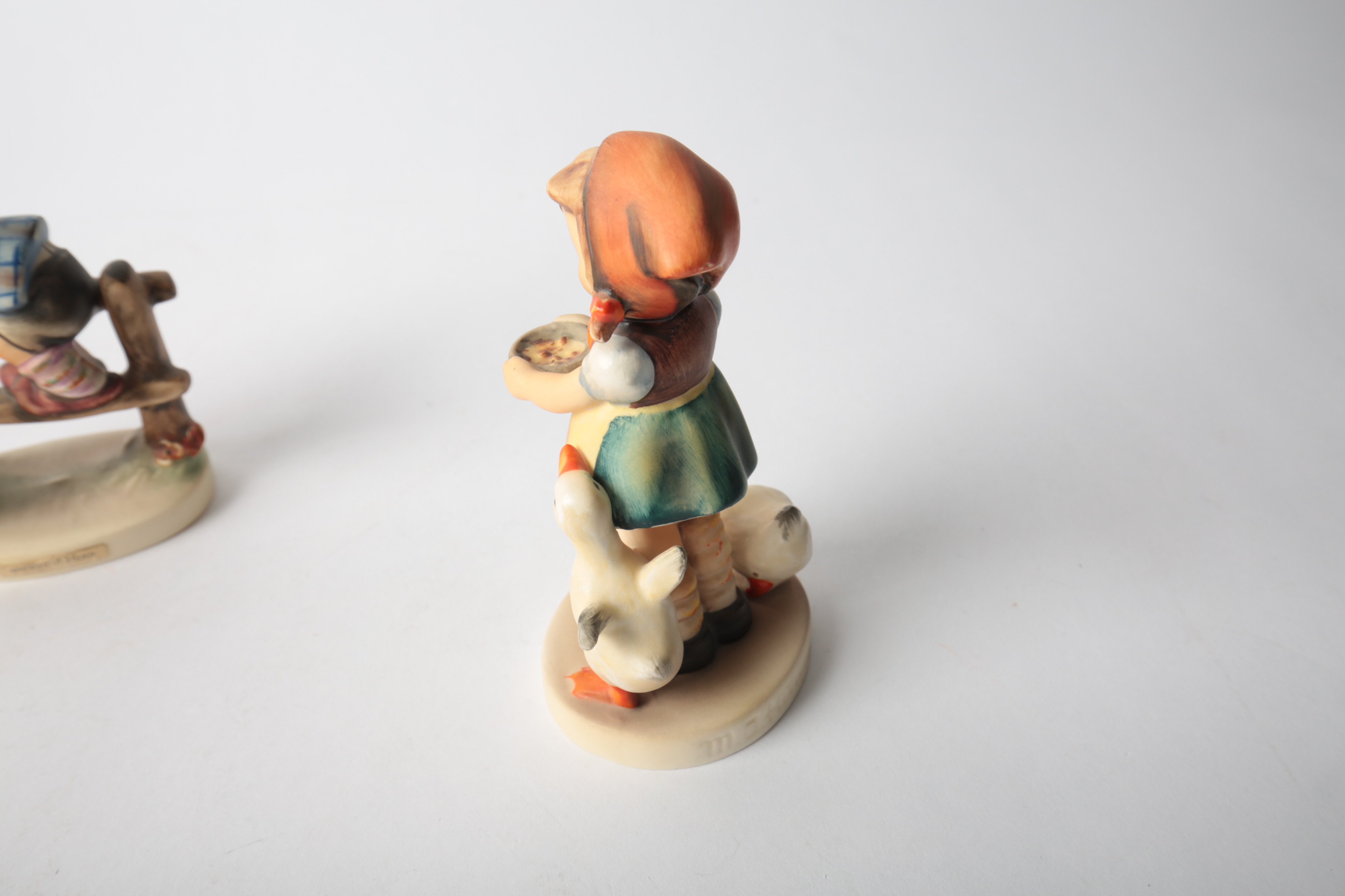 Pair of Porcelain Goebel Hummel Figurines "Be Patient" and "Barnyard Hero"