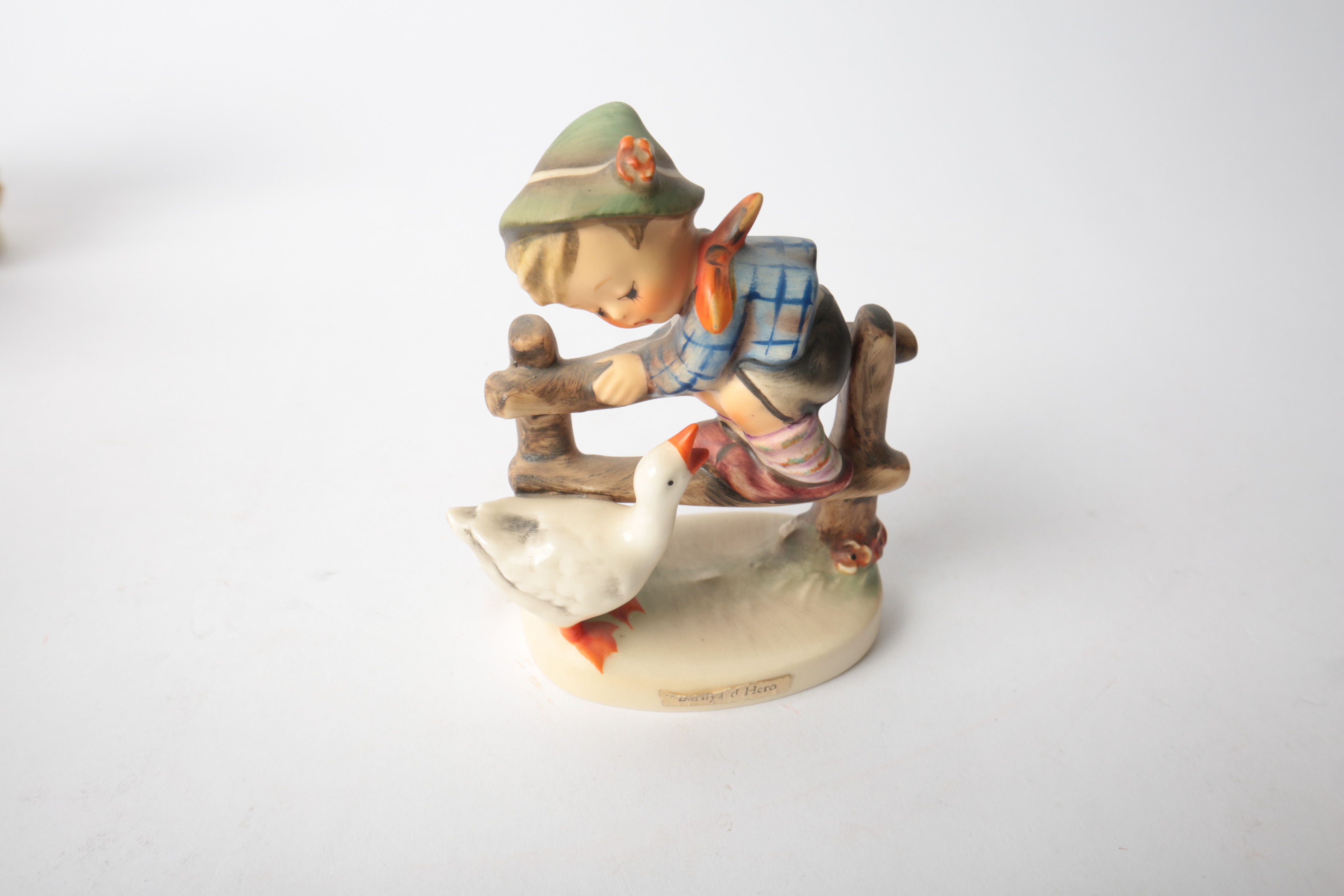 Pair of Porcelain Goebel Hummel Figurines "Be Patient" and "Barnyard Hero"