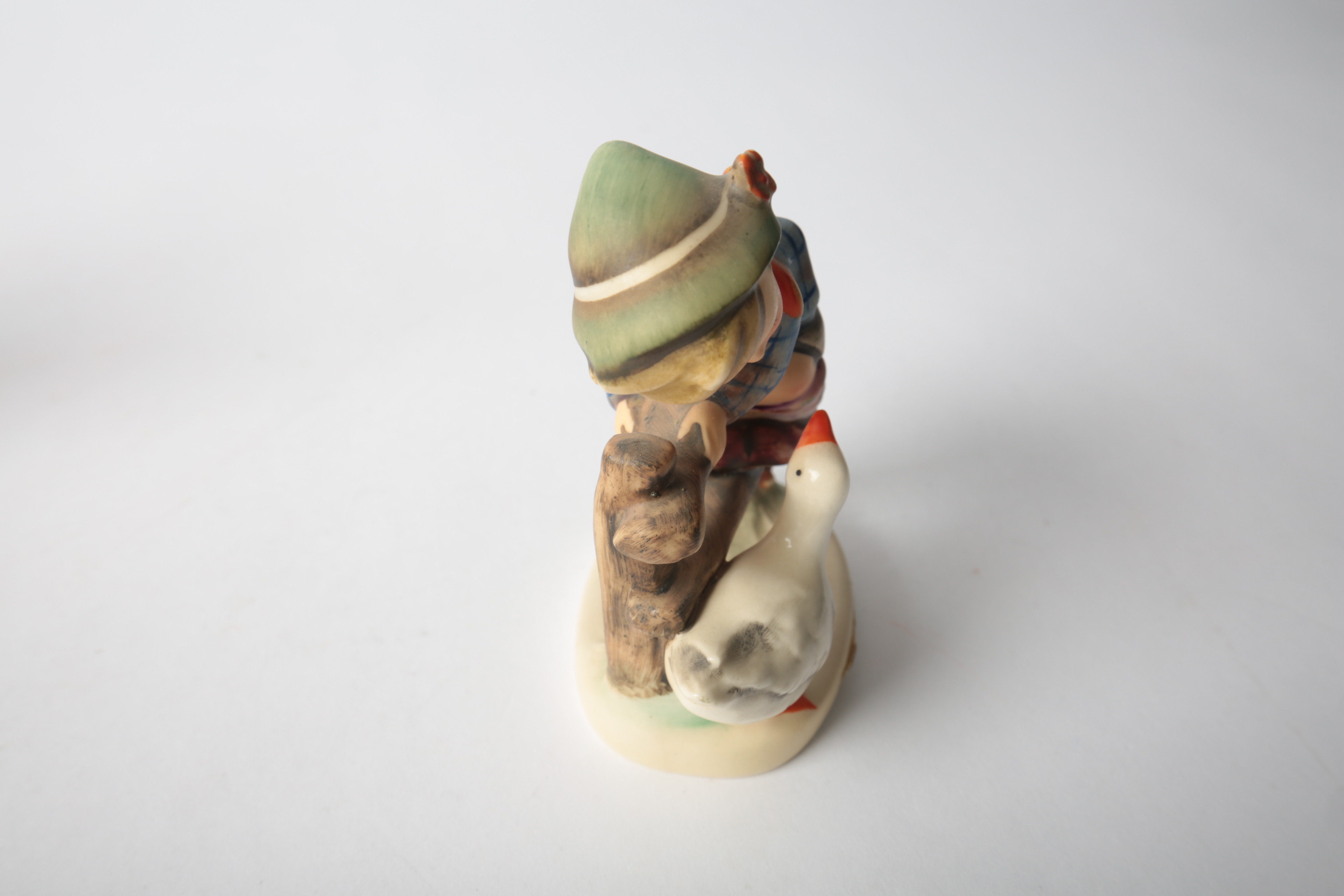 Pair of Porcelain Goebel Hummel Figurines "Be Patient" and "Barnyard Hero"