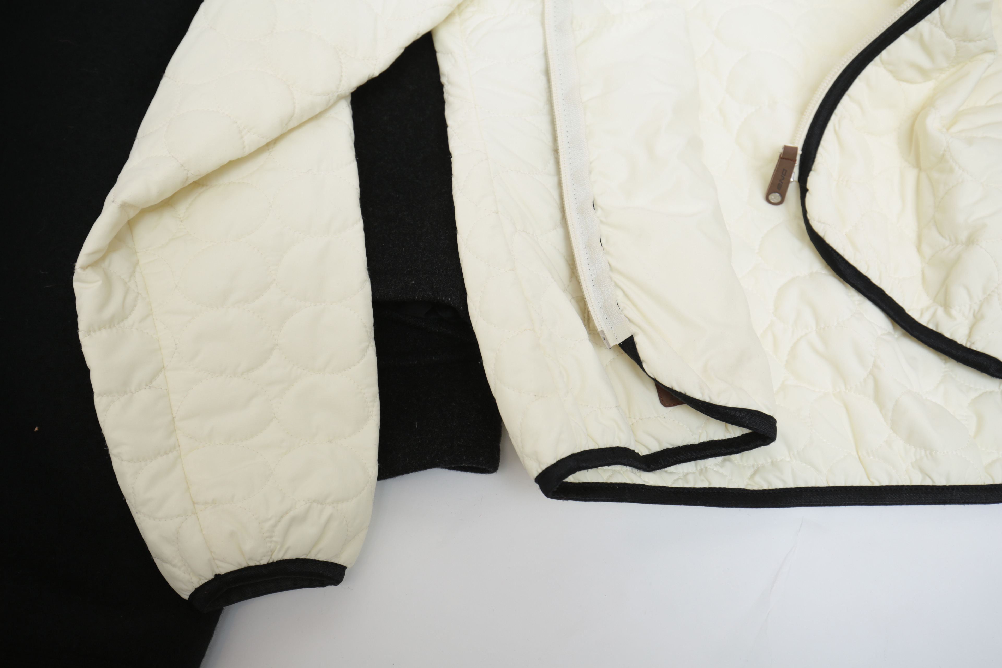 Collection of Black and White Coats Featuring Geiger and Brooks Brothers