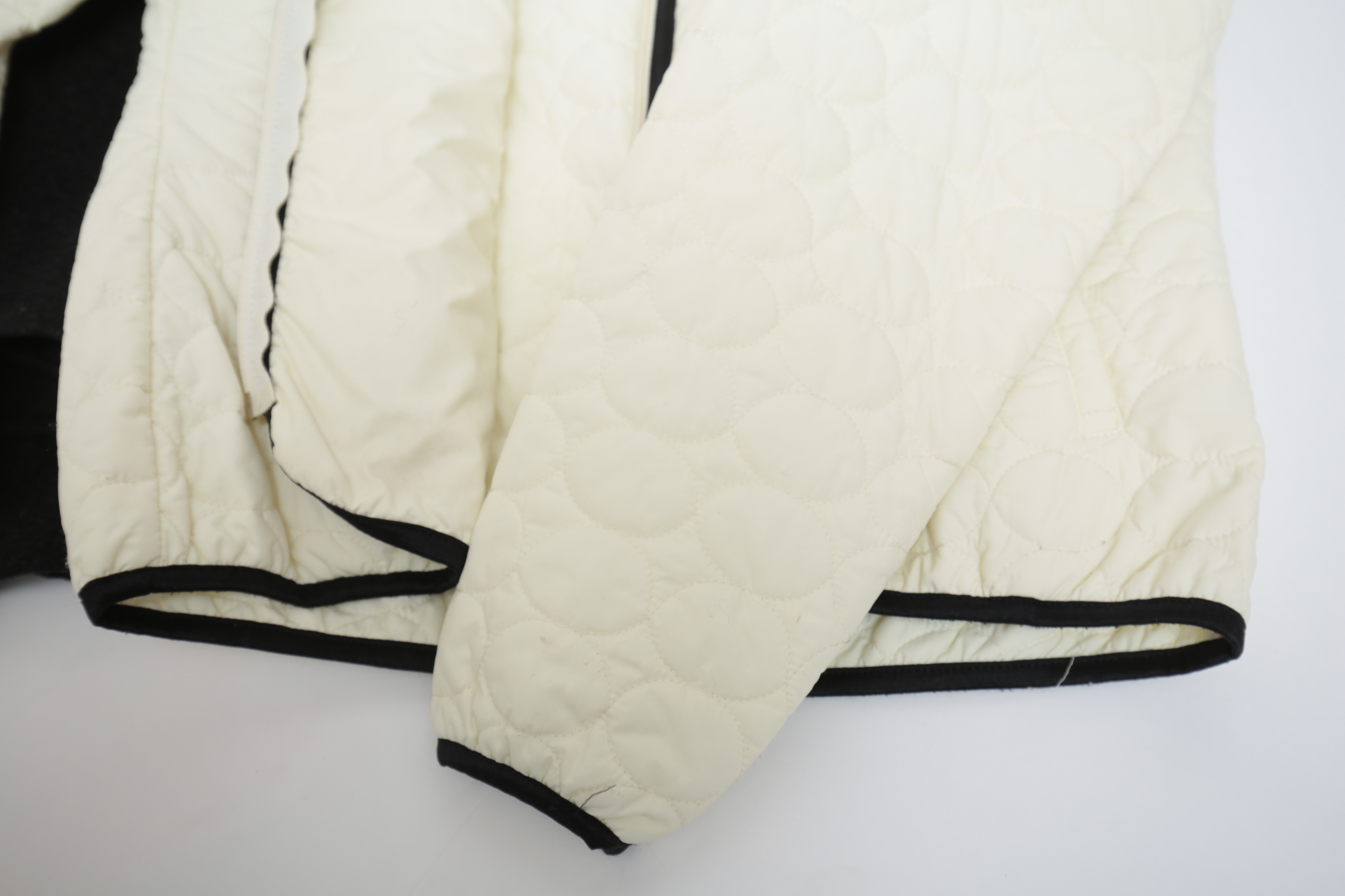 Collection of Black and White Coats Featuring Geiger and Brooks Brothers