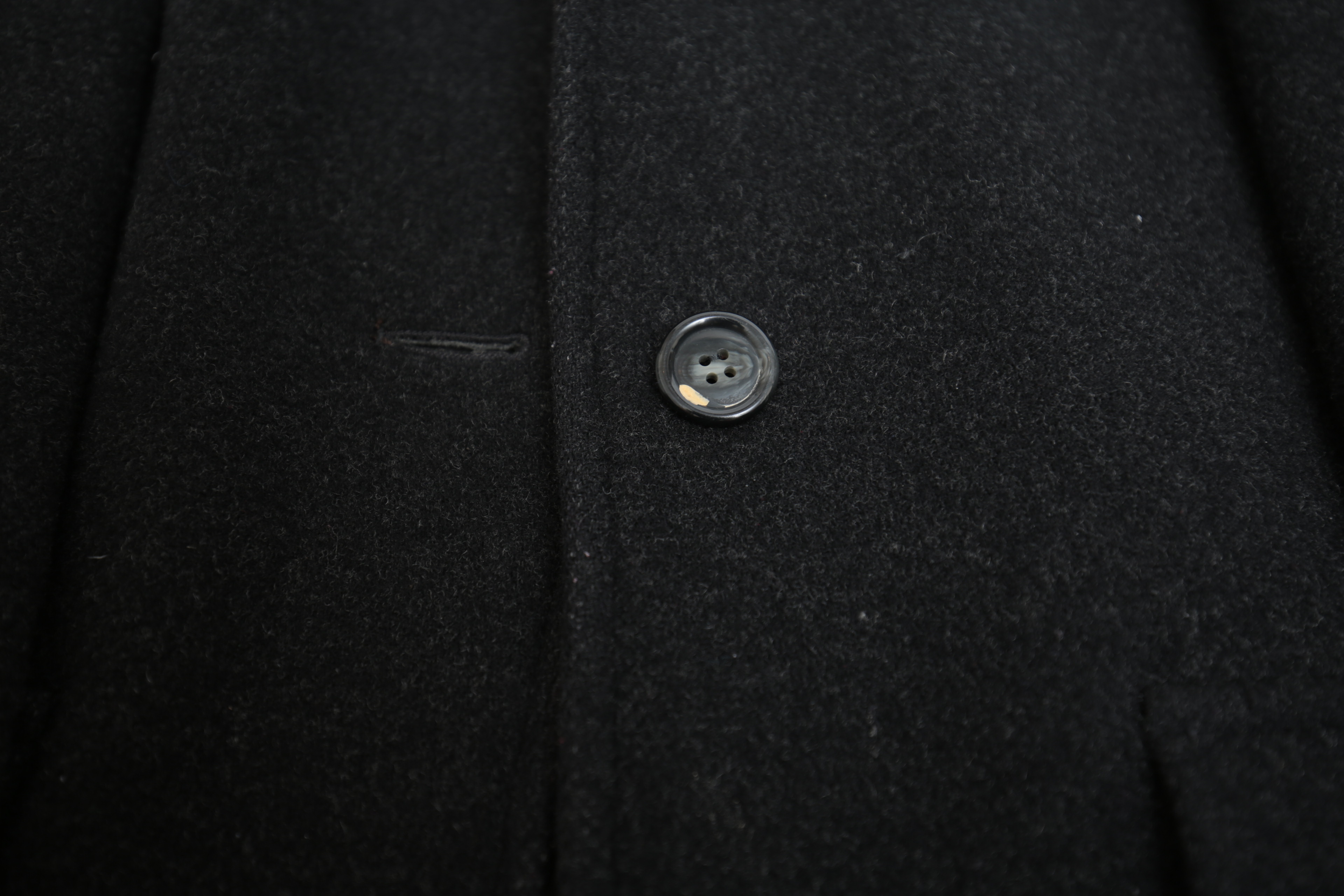 Collection of Black and White Coats Featuring Geiger and Brooks Brothers