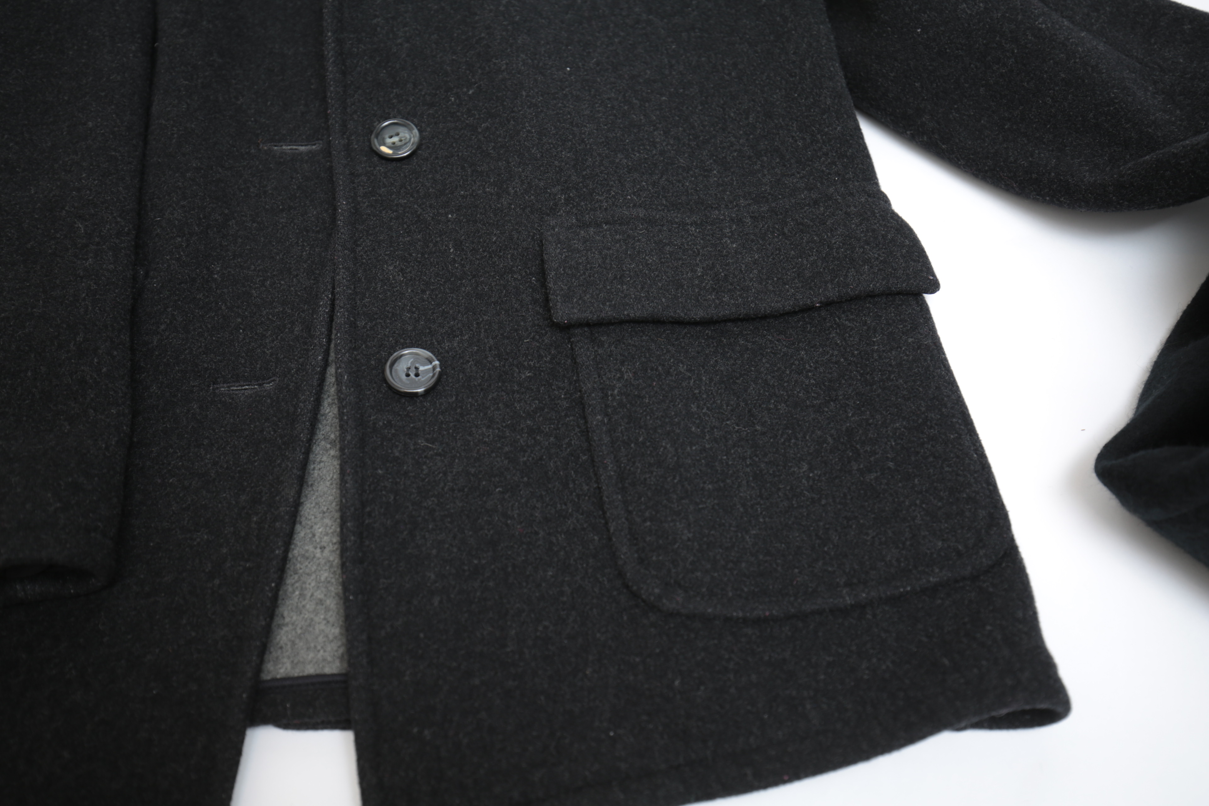 Collection of Black and White Coats Featuring Geiger and Brooks Brothers