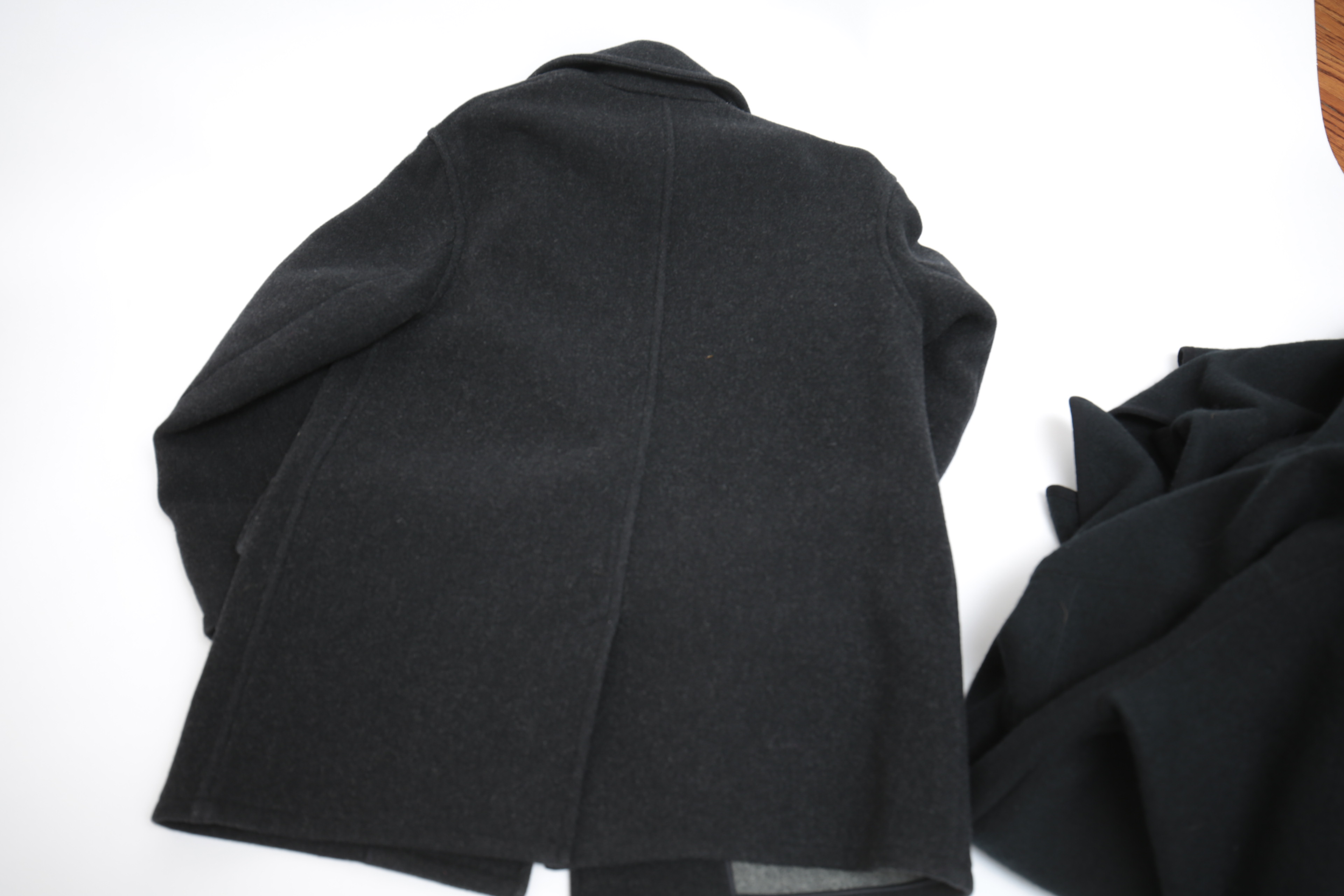 Collection of Black and White Coats Featuring Geiger and Brooks Brothers