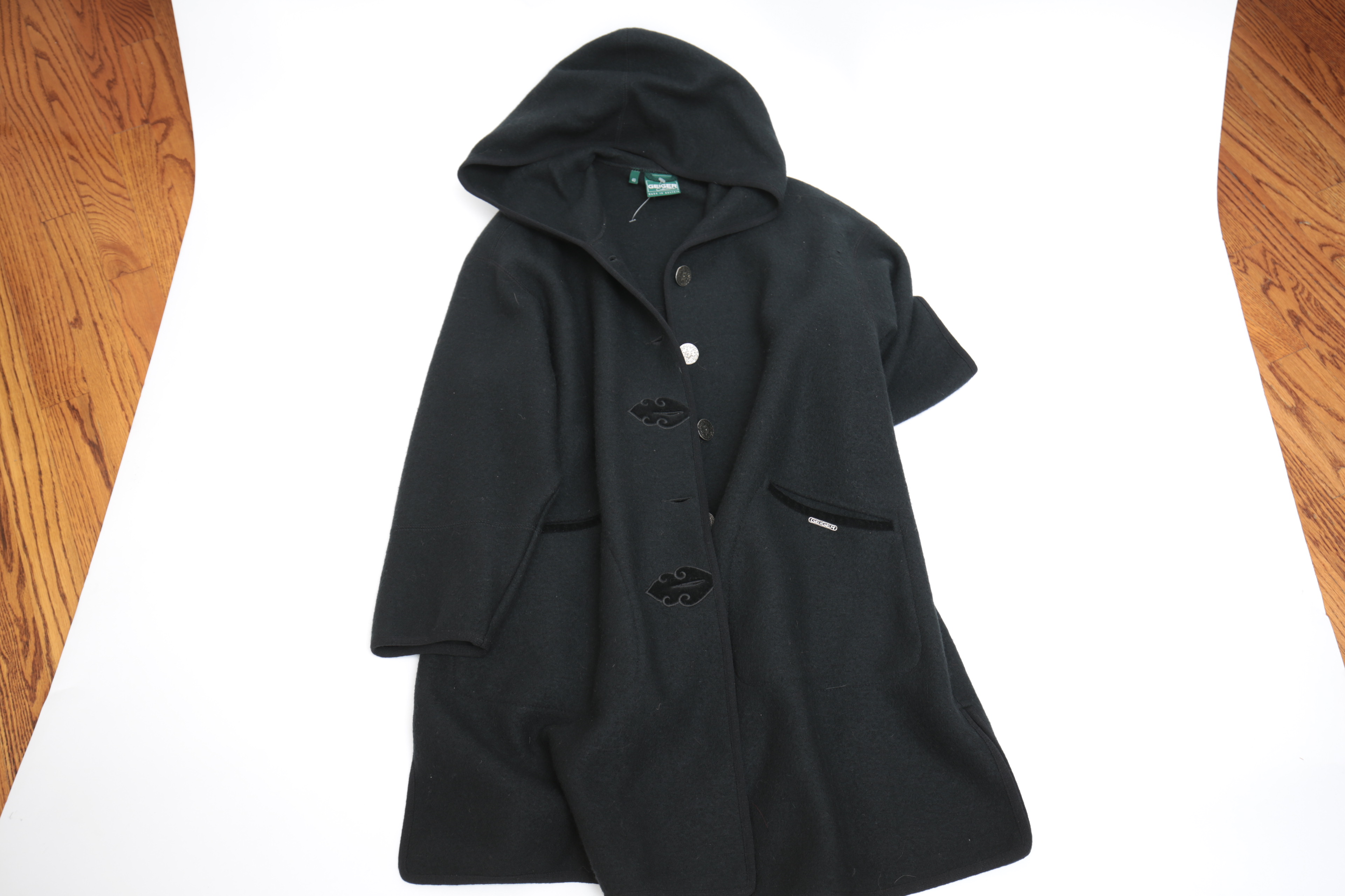 Collection of Black and White Coats Featuring Geiger and Brooks Brothers