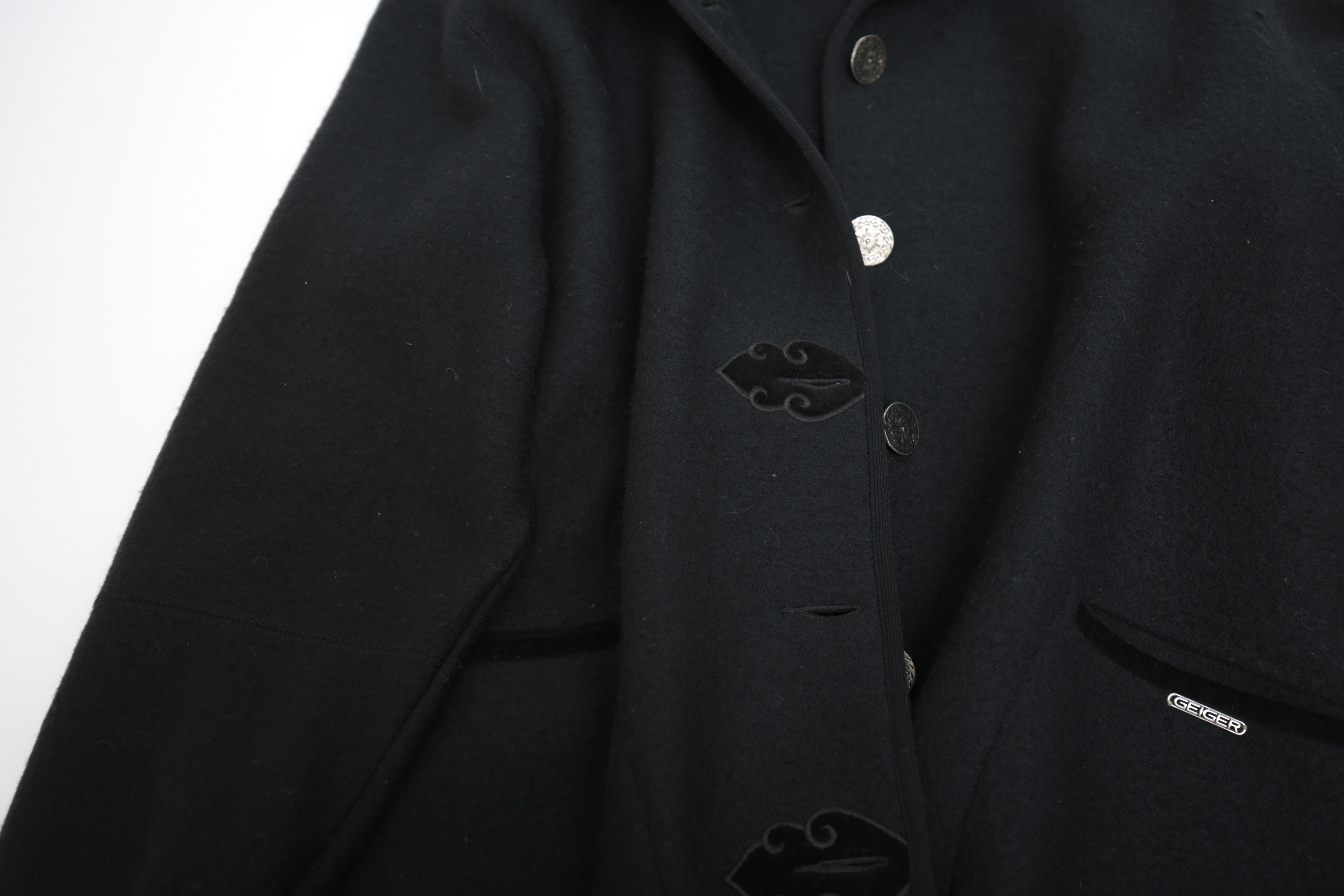 Collection of Black and White Coats Featuring Geiger and Brooks Brothers