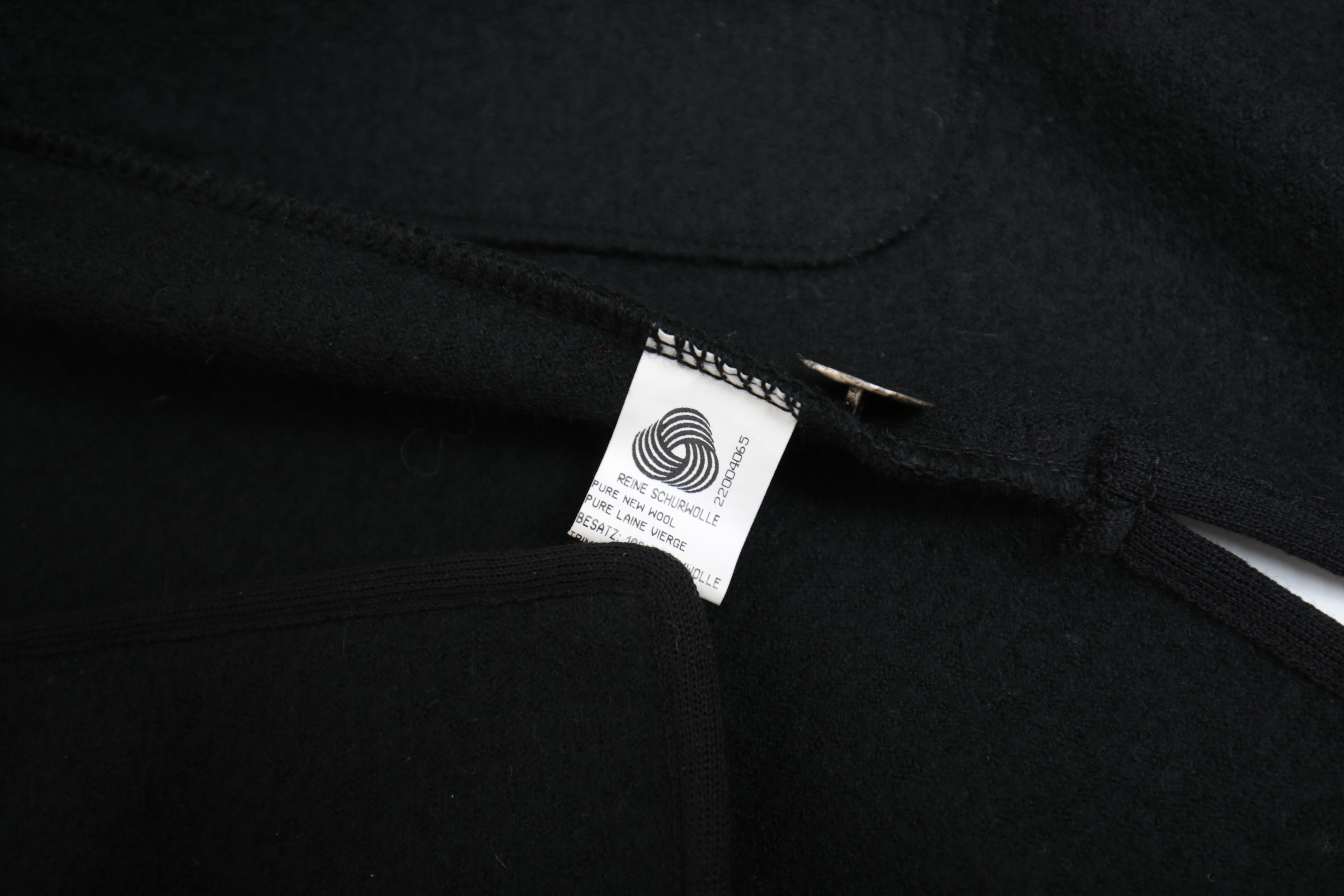 Collection of Black and White Coats Featuring Geiger and Brooks Brothers