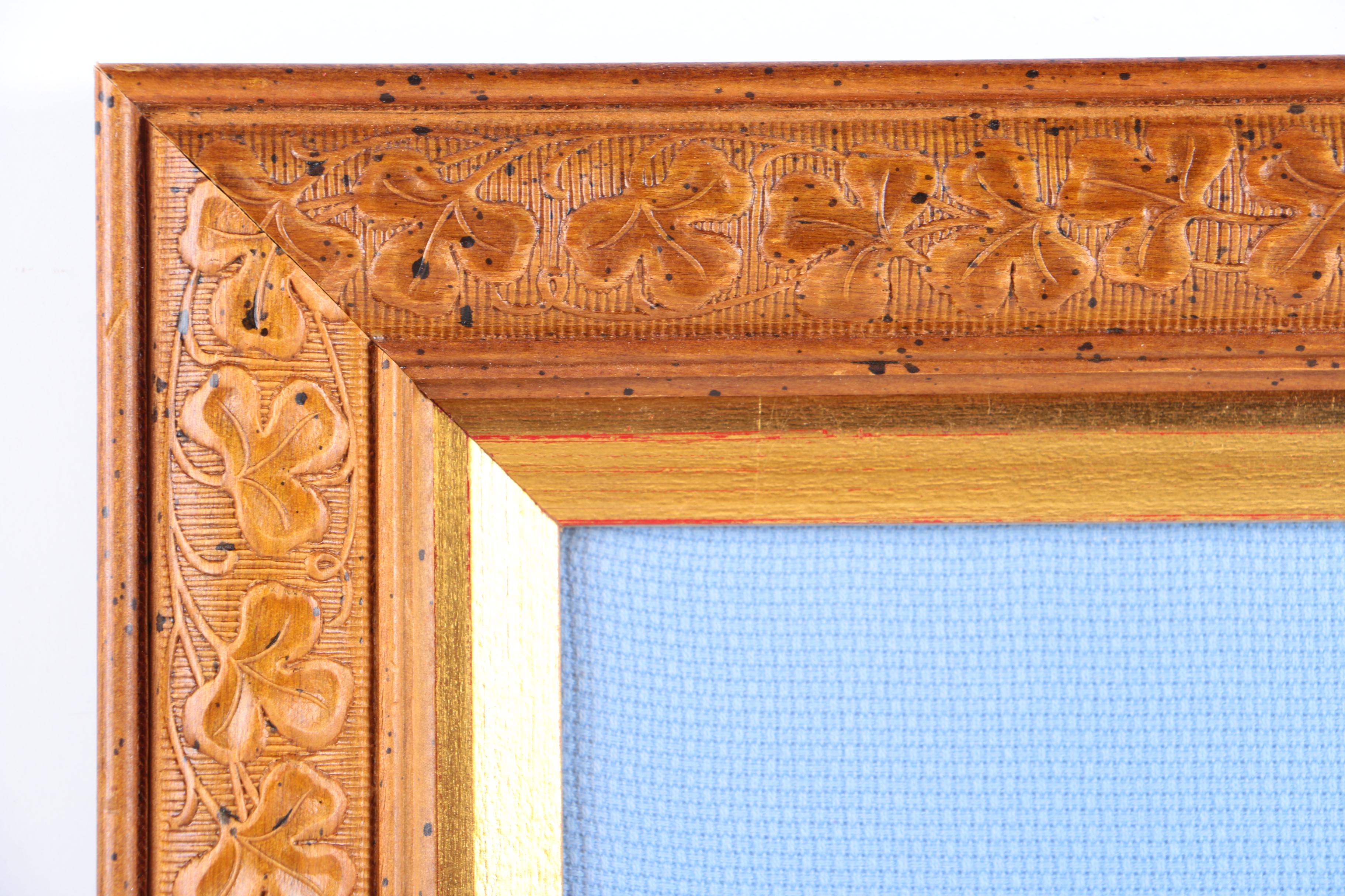 Cross-Stitch Embroidery of a Woman Surrounded by a Wreath
