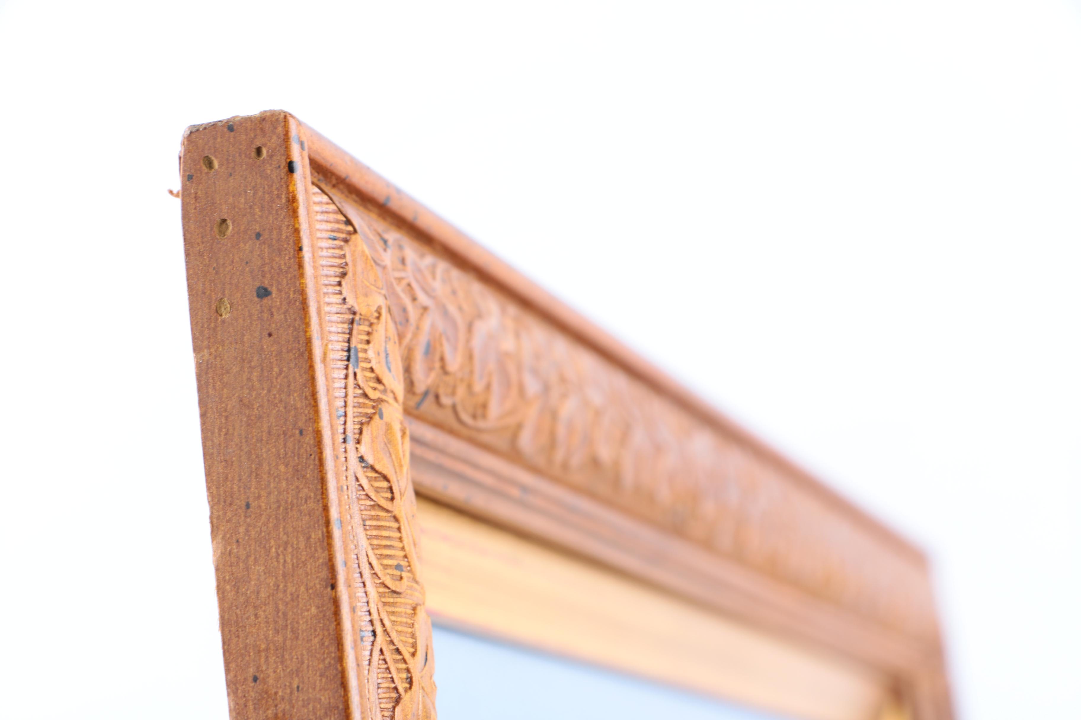 Cross-Stitch Embroidery of a Woman Surrounded by a Wreath