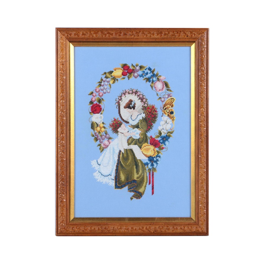 Cross-Stitch Embroidery of a Woman Surrounded by a Wreath