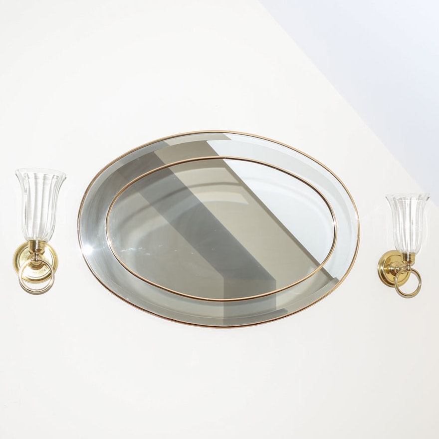 Oval Wall Mirror with Brass Detailing and Wall Sconces